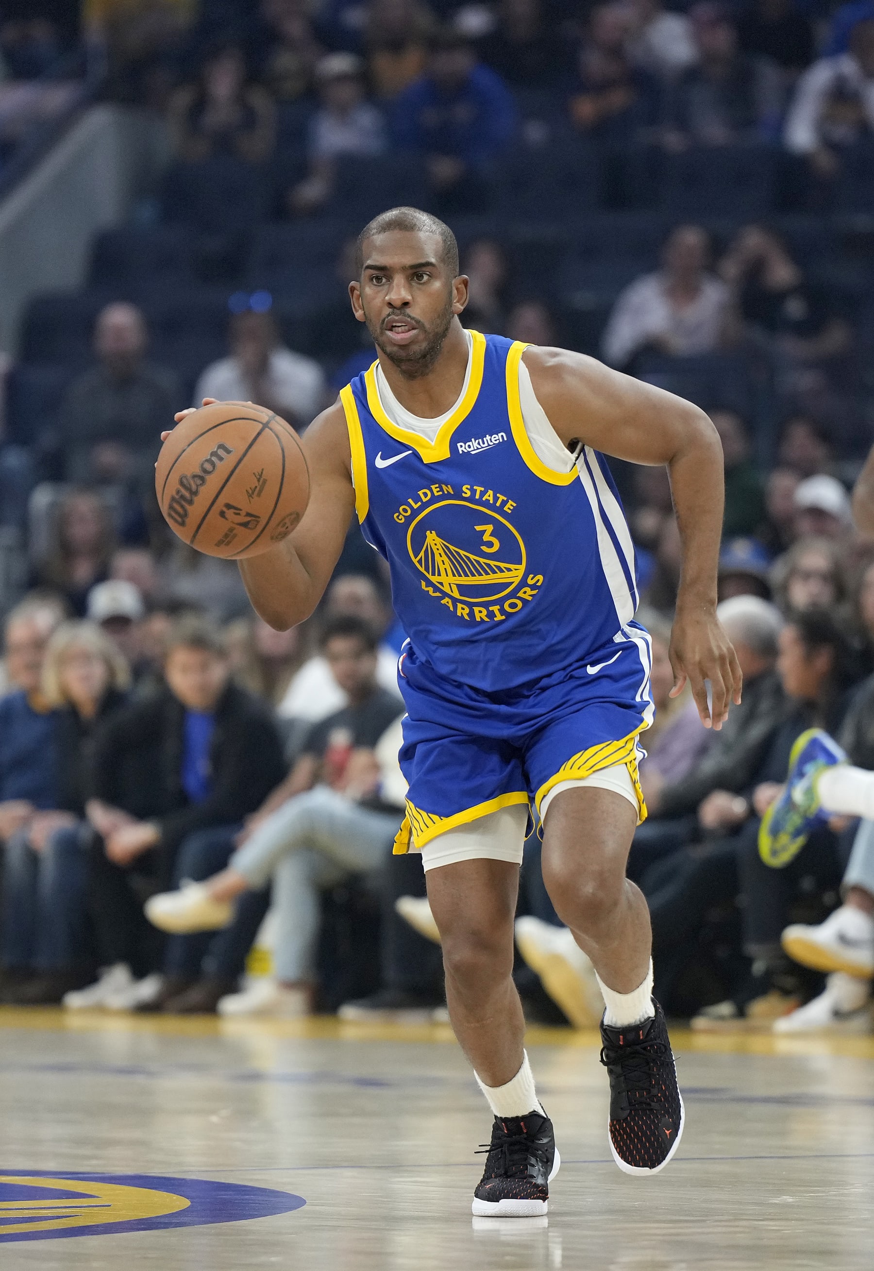SAN FRANCISCO, CALIFORNIA - JANUARY 04: Chris Paul #3 of the Golden State Warriors dribbles the ball up court against the Denver Nuggets during the first quarter of an NBA basketball game at Chase Center on January 04, 2024 in San Francisco, California. NOTE TO USER: User expressly acknowledges and agrees that, by downloading and or using this photograph, User is consenting to the terms and conditions of the Getty Images License Agreement. (Photo by Thearon W. Henderson/Getty Images)
