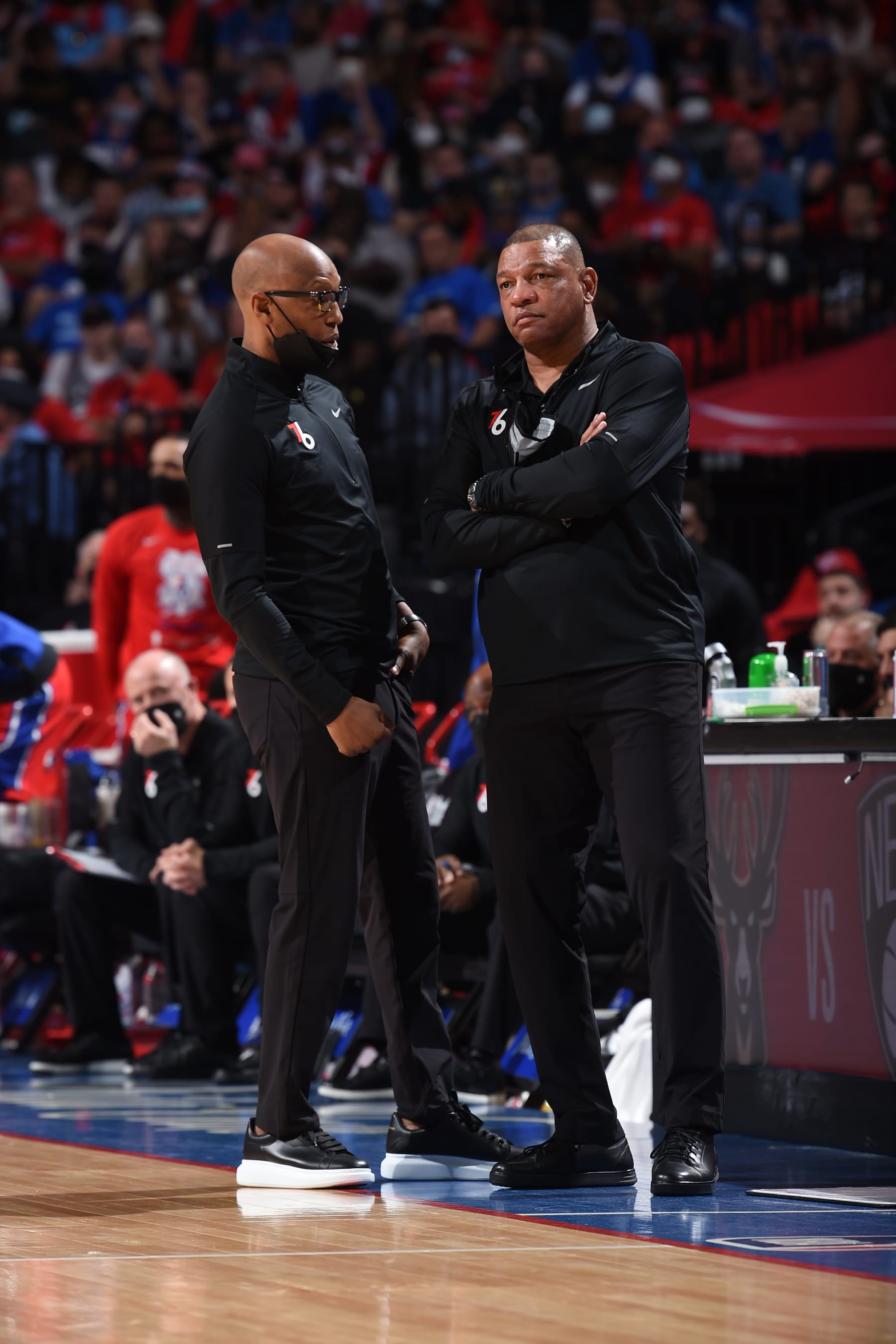PHILADELPHIA, PA - JUNE 6: Assistant Coach Sam Cassell and Head Coach Doc Rivers of the Philadelphia 76ers talk during a game against the Atlanta Hawks during Round 2, Game 1 of the Eastern Conference Playoffs on June 6, 2021 at Wells Fargo Center in Philadelphia, Pennsylvania. NOTE TO USER: User expressly acknowledges and agrees that, by downloading and/or using this Photograph, user is consenting to the terms and conditions of the Getty Images License Agreement. Mandatory Copyright Notice: Copyright 2021 NBAE (Photo by David Dow/NBAE via Getty Images)