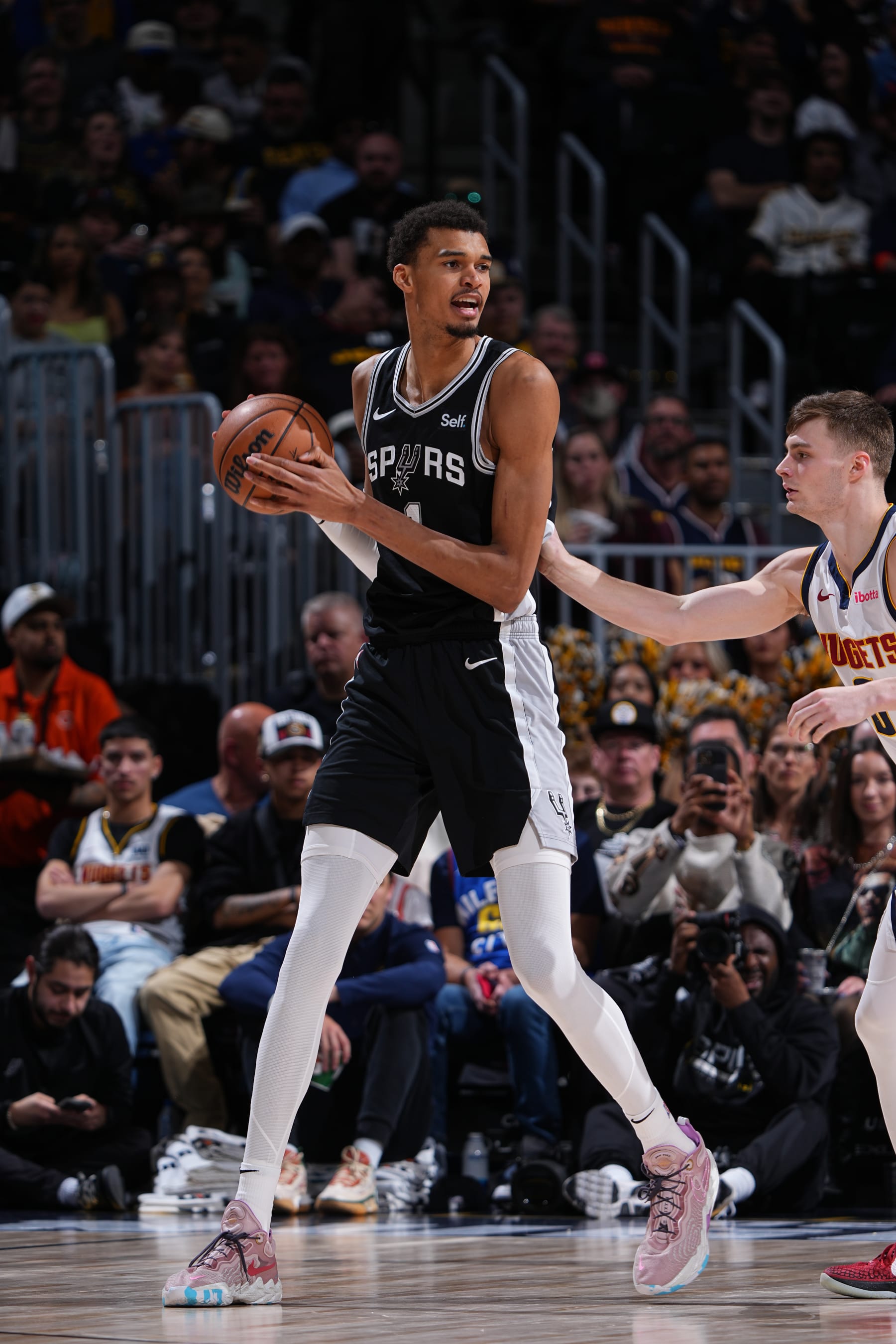 DENVER, CO - APRIL 2: Victor Wembanyama #1 of the San Antonio Spurs handles the ball during the game against the Denver Nuggets on April 2, 2024 at the Ball Arena in Denver, Colorado. NOTE TO USER: User expressly acknowledges and agrees that, by downloading and/or using this Photograph, user is consenting to the terms and conditions of the Getty Images License Agreement. Mandatory Copyright Notice: Copyright 2024 NBAE (Photo by Garrett Ellwood/NBAE via Getty Images)