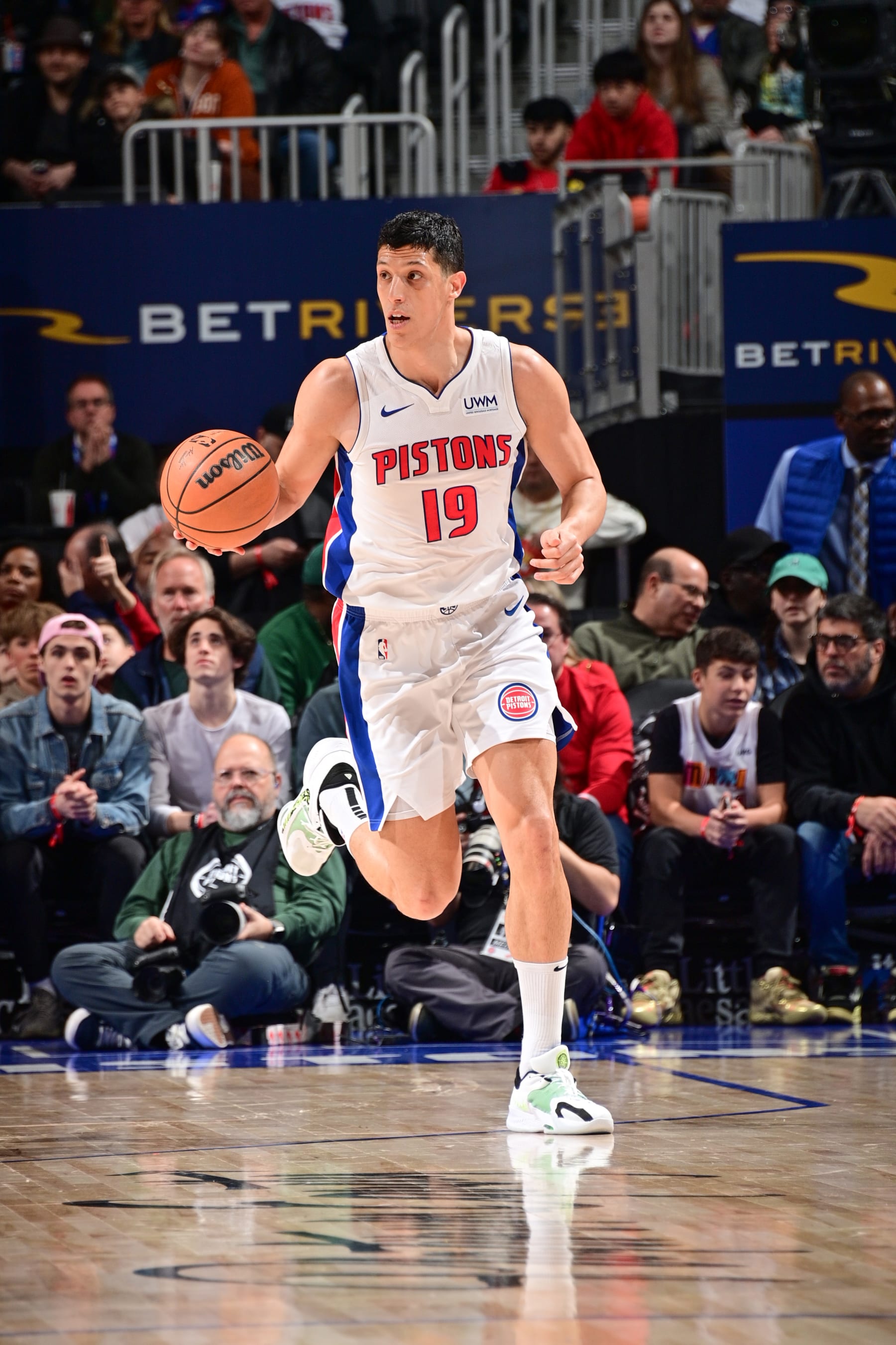 DETROIT, MI - MARCH 17: Simone Fontecchio #19 of the Detroit Pistons handles the ball during the game  on March 17, 2024 at Little Caesars Arena in Detroit, Michigan. NOTE TO USER: User expressly acknowledges and agrees that, by downloading and/or using this photograph, User is consenting to the terms and conditions of the Getty Images License Agreement. Mandatory Copyright Notice: Copyright 2024 NBAE (Photo by Chris Schwegler/NBAE via Getty Images)
