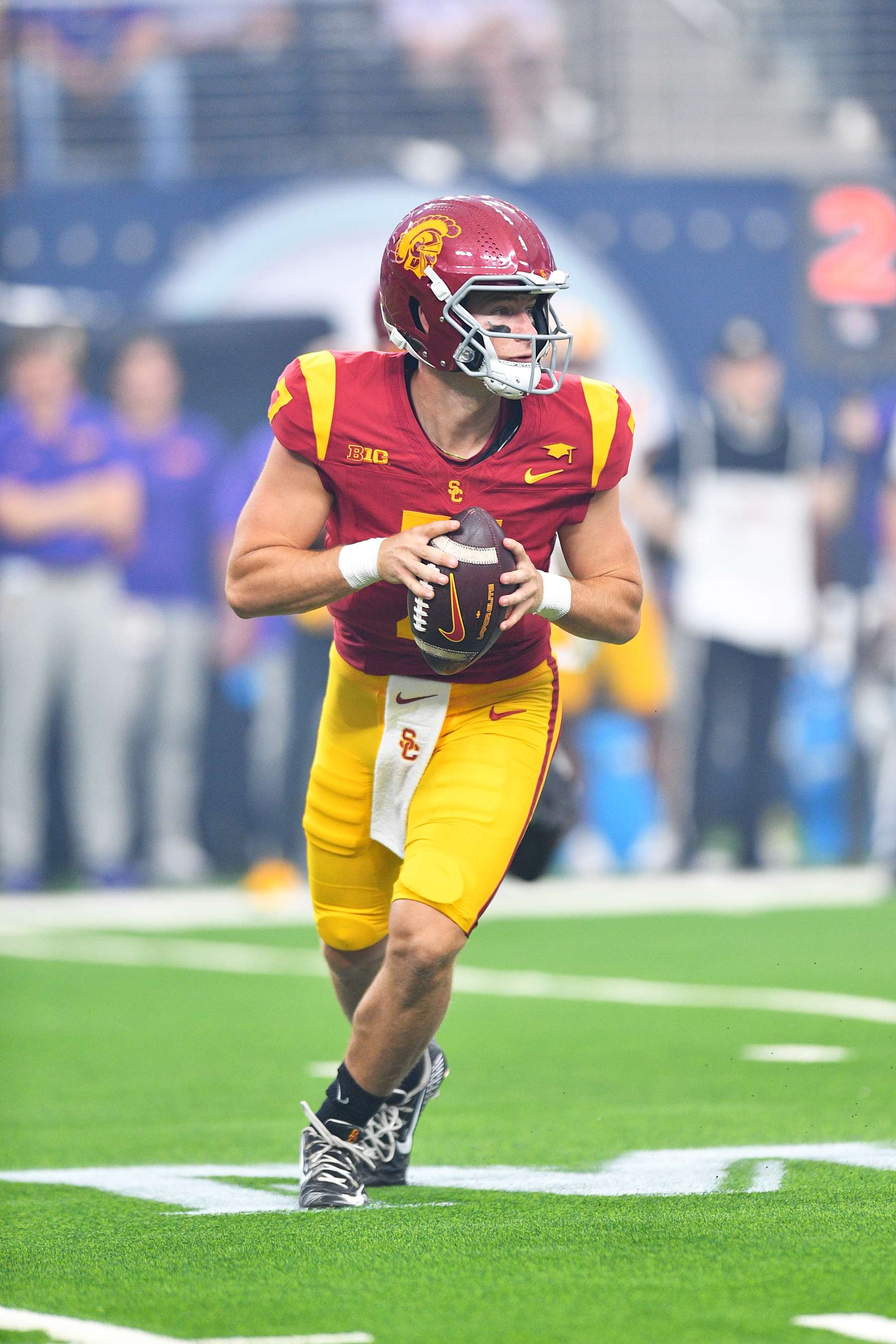 LAS VEGAS, NV - SEPTEMBER 01: USC Trojans quarterback Miller Moss (7) rolls out during the Modelo Vegas Kickoff Classic game between the LSU Tigers and the USC Trojans on September 1, 2024 at Allegiant Stadium in Las Vegas, Nevada. (Photo by Brian Rothmuller/Icon Sportswire via Getty Images)