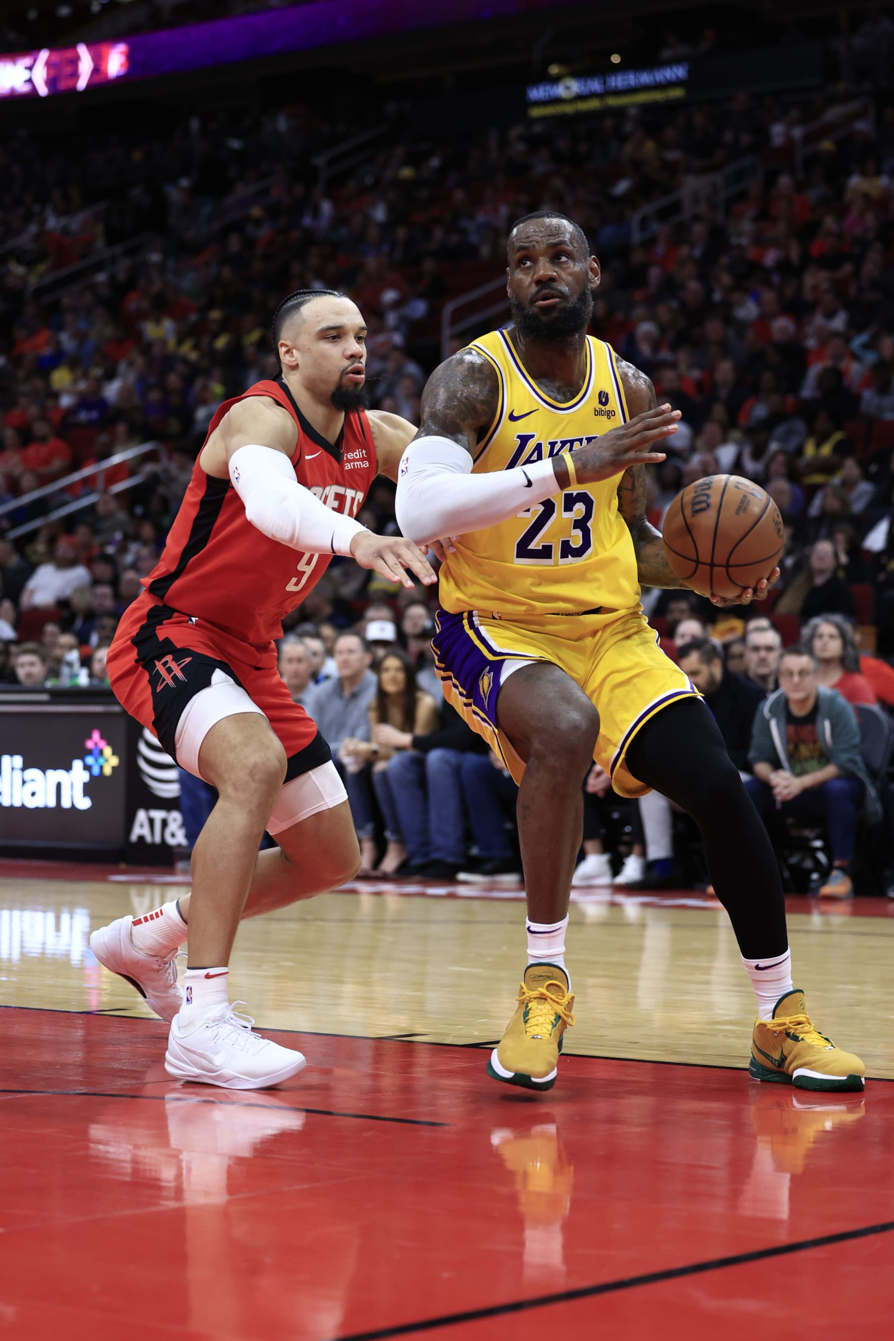 HOUSTON, TEXAS - JANUARY 29: LeBron James #23 of the Los Angeles Lakers drives to the net ahead Dillon Brooks #9 of the Houston Rockets during the first half at Toyota Center on January 29, 2024 in Houston, Texas. NOTE TO USER: User expressly acknowledges and agrees that, by downloading and or using this photograph, User is consenting to the terms and conditions of the Getty Images License Agreement.  (Photo by Carmen Mandato/Getty Images)