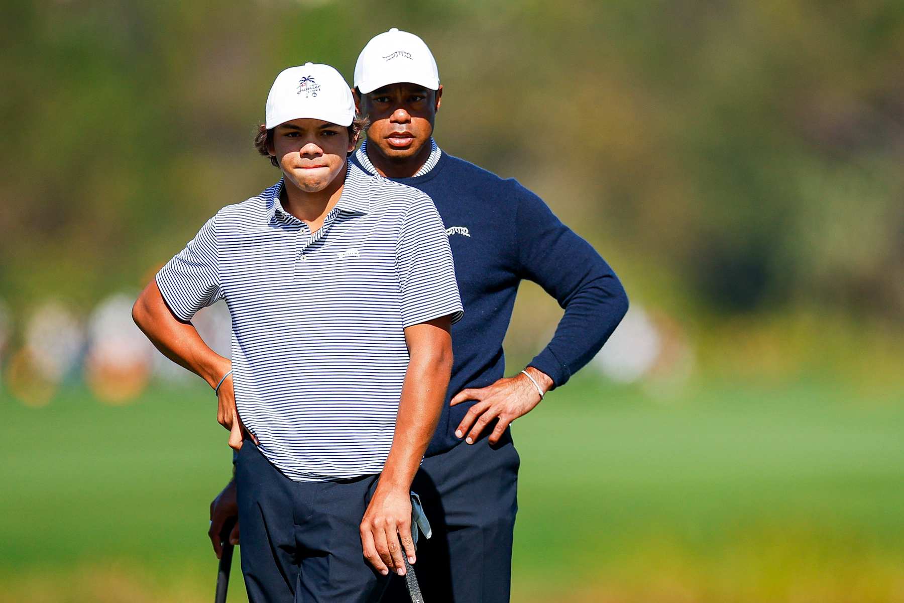 ORLANDO, FLORIDA - DECEMBER 21: Tiger Woods and his son Charlie Woods look over a putt on the fifth hole during the first round of the PNC Championship at Ritz-Carlton Golf Club on December 21, 2024 in Orlando, Florida. (Photo by Mike Ehrmann/Getty Images)