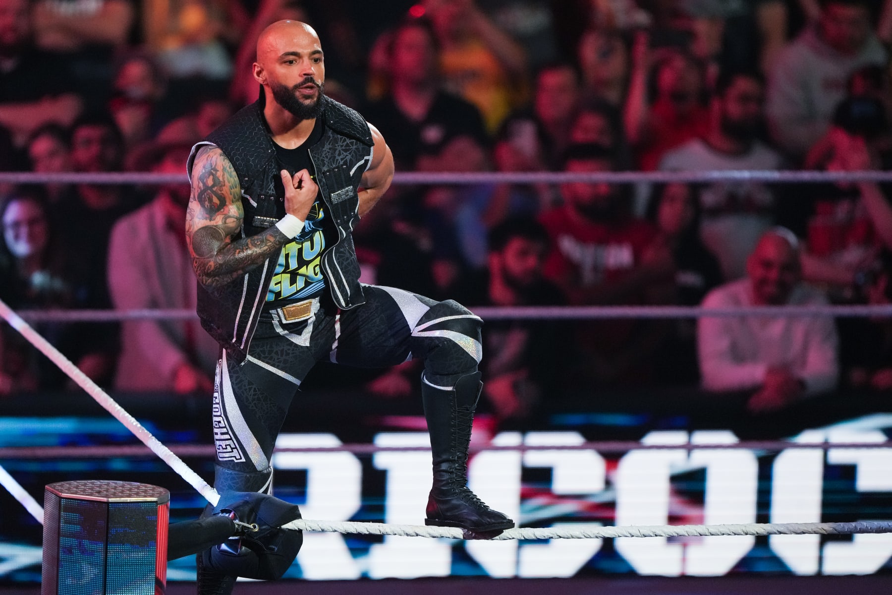 HOUSTON, TEXAS - MARCH 11: Ricochet is introduced prior to his match during WWE Monday Night RAW at Toyota Center on March 11, 2024 in Houston, Texas. (Photo by Alex Bierens de Haan/Getty Images)