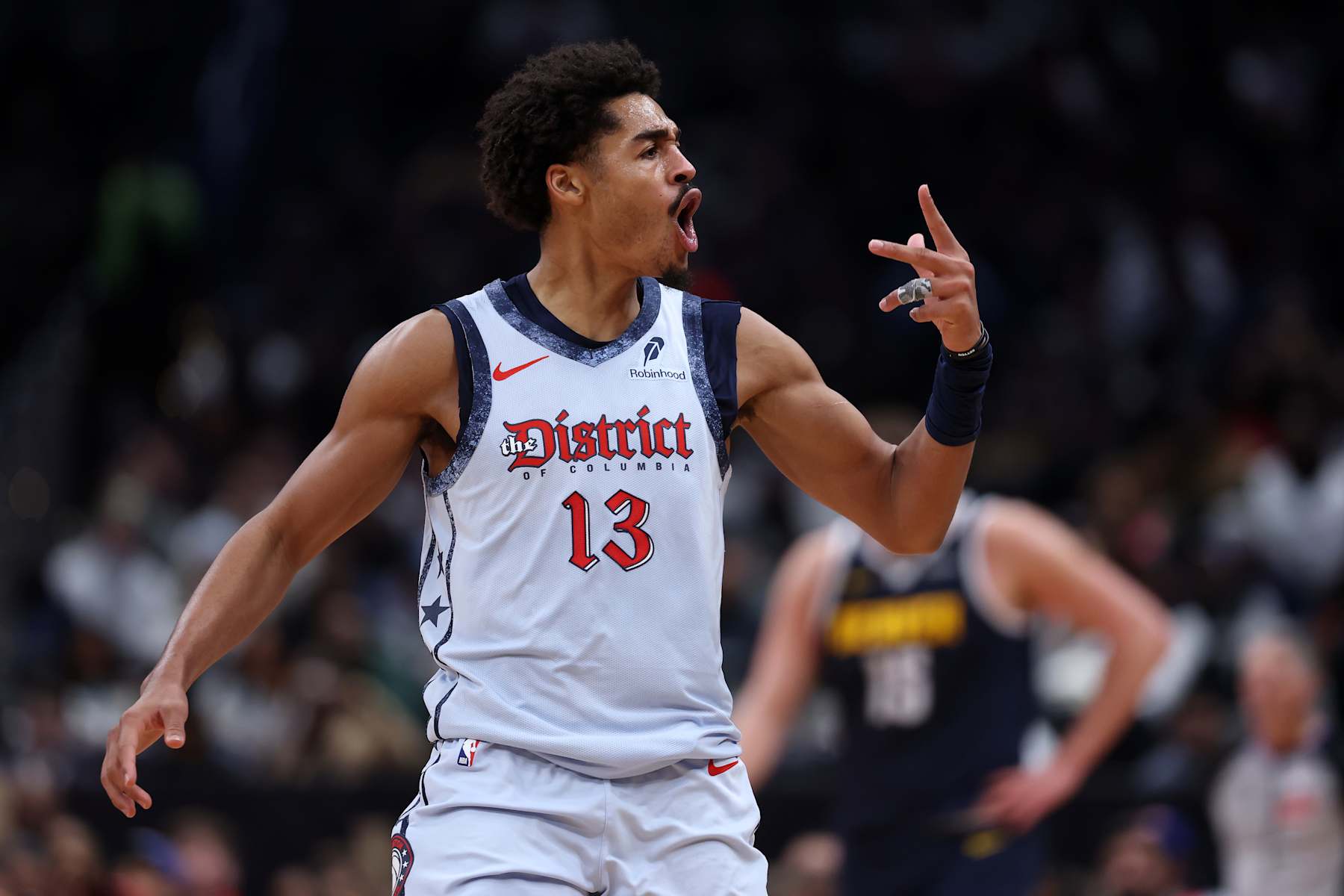 WASHINGTON, DC - DECEMBER 07: Jordan Poole #13 of the Washington Wizards celebrates after scoring against the Denver Nuggets during the second half at Capital One Arena on December 7, 2024 in Washington, DC. NOTE TO USER: User expressly acknowledges and agrees that, by downloading and or using this photograph, User is consenting to the terms and conditions of the Getty Images License Agreement. (Photo by Patrick Smith/Getty Images)