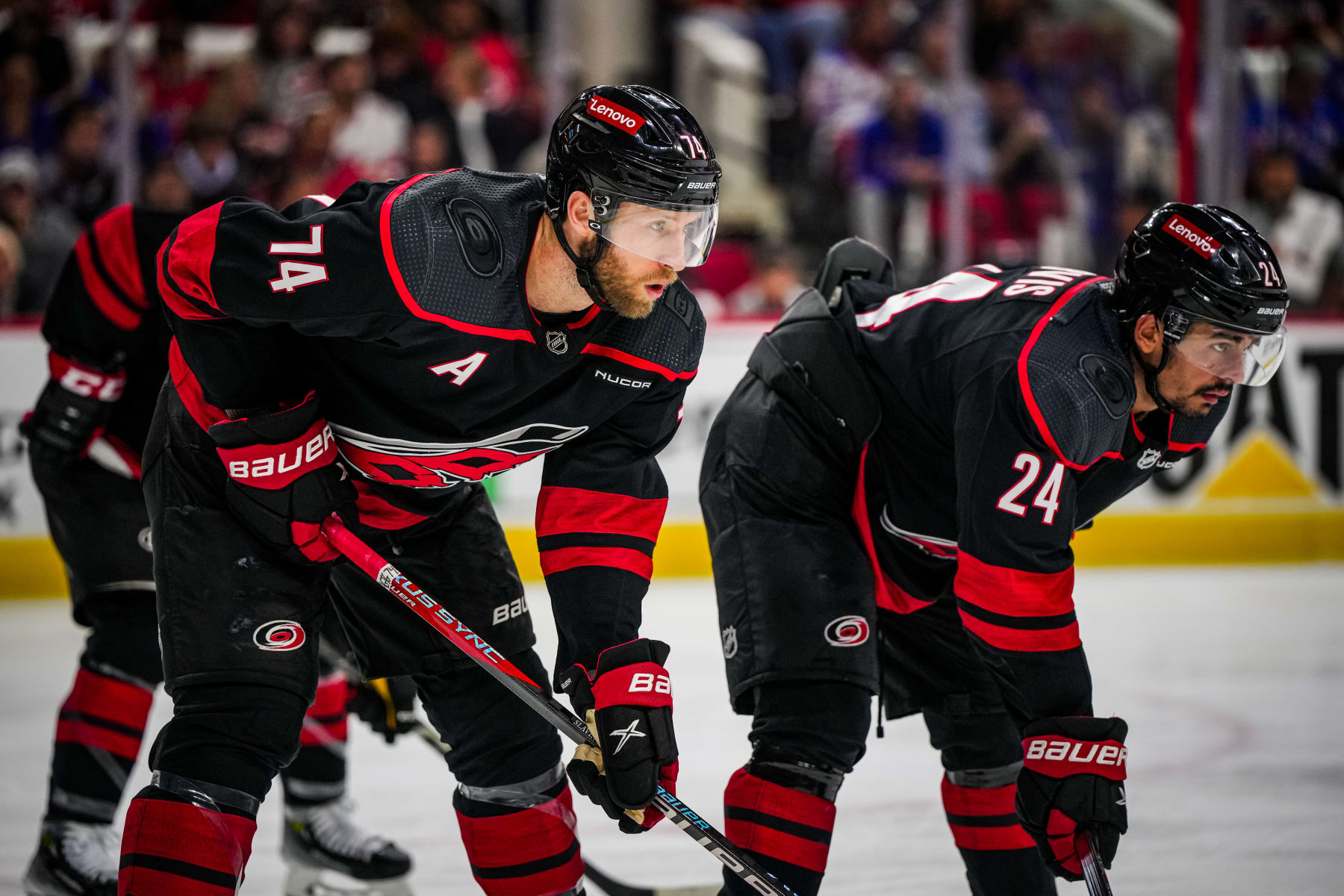 RALEIGH, NORTH CAROLINA - MAY 11: Jaccob Slavin #74 and Seth Jarvis #24 get set for a face-off against the New York Rangers during the second period in Game Four of the Second Round of the 2024 Stanley Cup Playoffs at PNC Arena on May 11, 2024 in Raleigh, North Carolina.  (Photo by Josh Lavallee/NHLI via Getty Images)