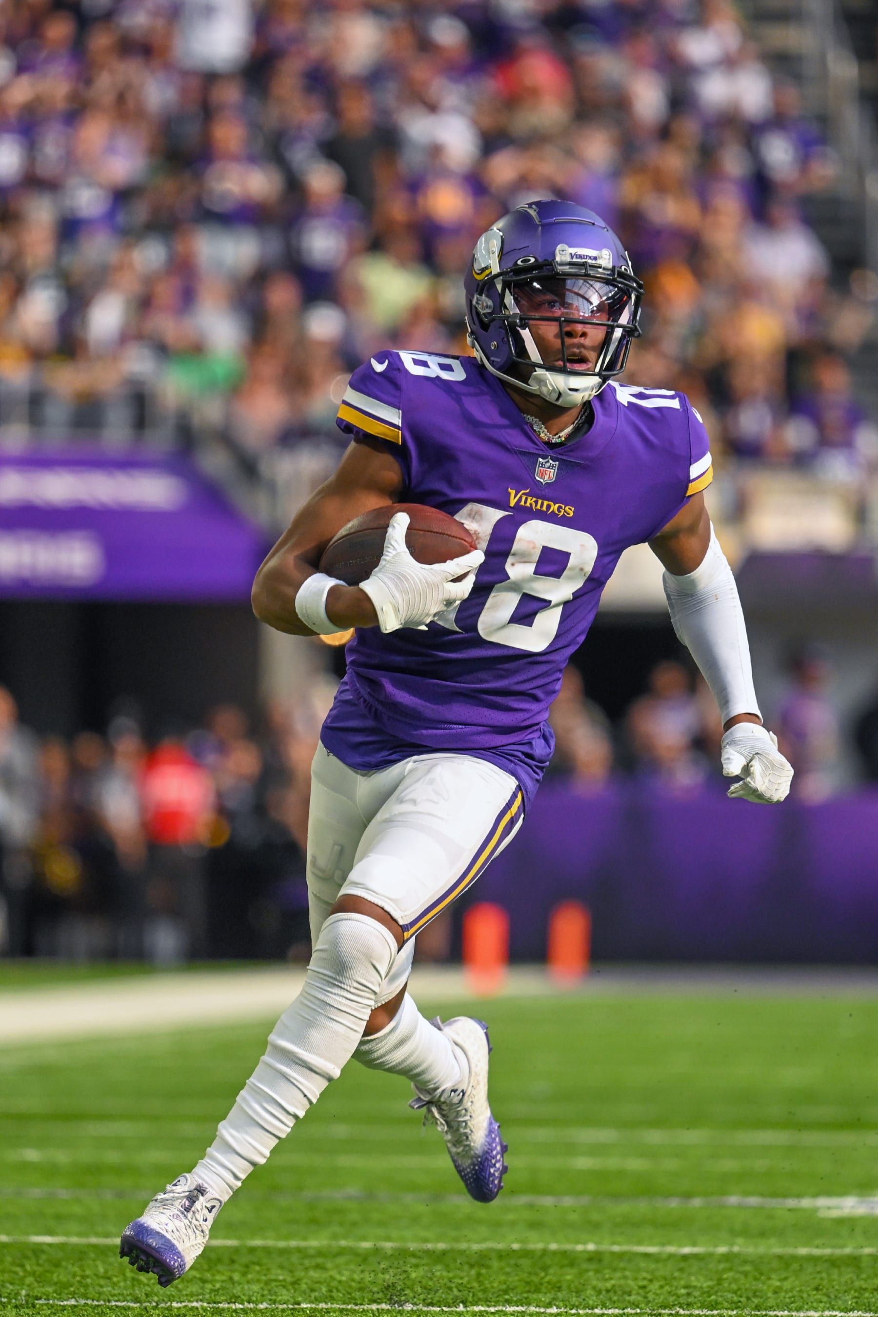MINNEAPOLIS, MN - SEPTEMBER 11: Minnesota Vikings wide receiver Justin Jefferson (18) runs to the end zone for a 36-yard touchdown reception during the second quarter of an NFL game between the Minnesota Vikings and Green Bay Packers on September 11, 2022 at U.S. Bank Stadium in Minneapolis, MN.(Photo by Nick Wosika/Icon Sportswire via Getty Images)