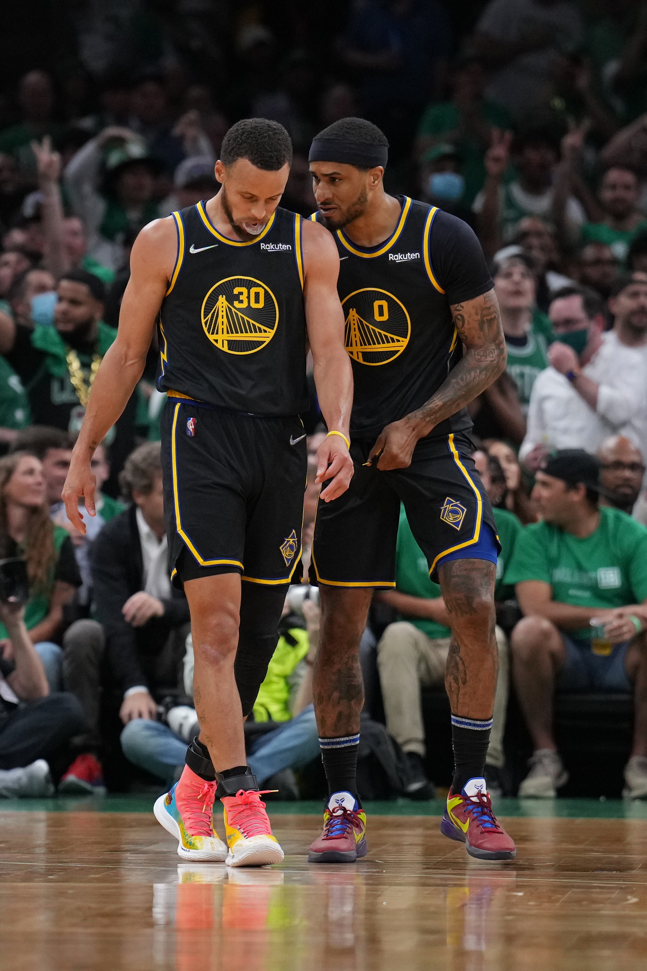 BOSTON, MA - JUNE 8: Gary Payton II #0 of the Golden State Warriors talks with Stephen Curry #30 of the Golden State Warriors during Game Three of the 2022 NBA Finals on June 8, 2022 at the TD Garden in Boston, Massachusetts.  NOTE TO USER: User expressly acknowledges and agrees that, by downloading and or using this photograph, User is consenting to the terms and conditions of the Getty Images License Agreement. Mandatory Copyright Notice: Copyright 2022 NBAE  (Photo by Jesse D. Garrabrant/NBAE via Getty Images)