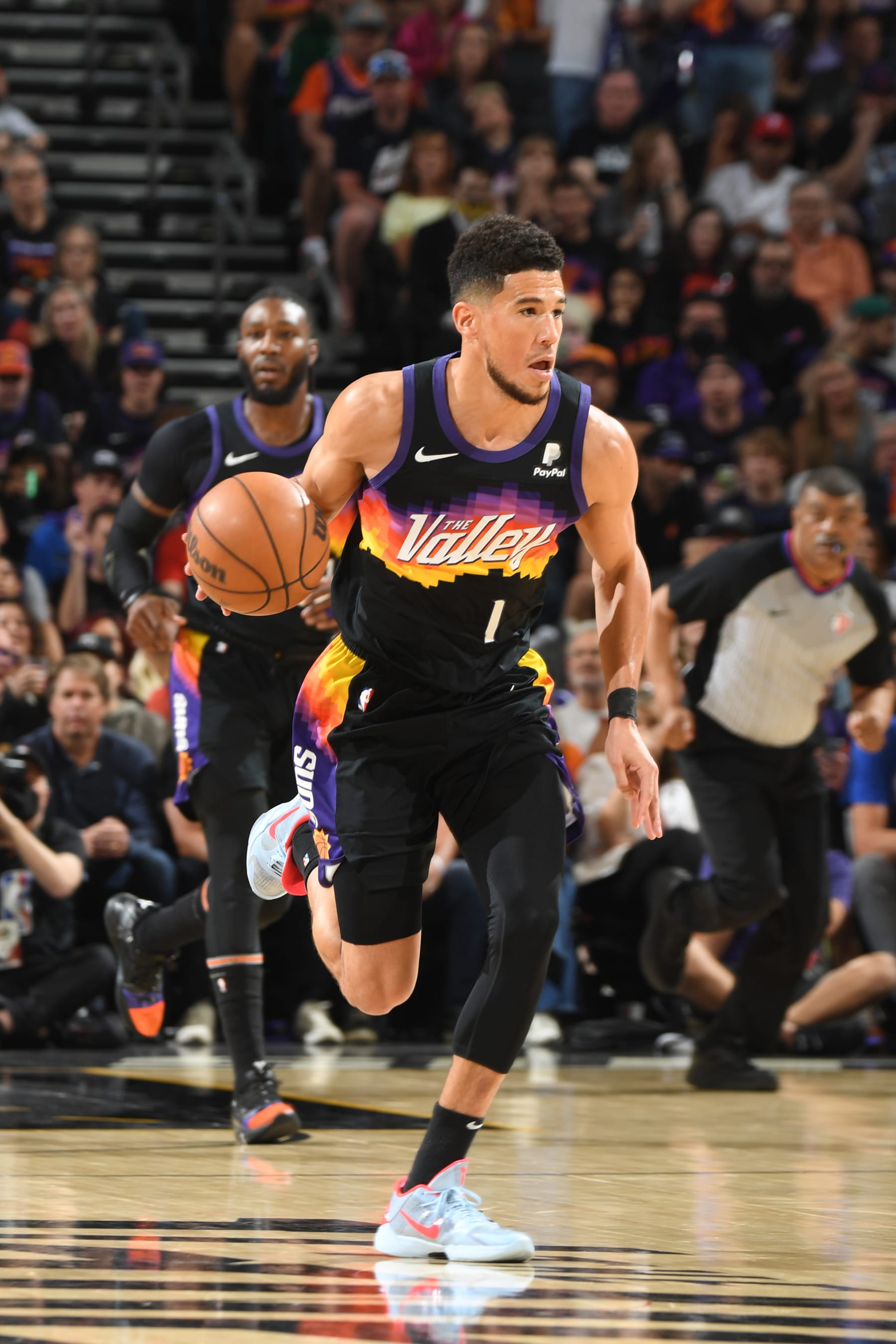 PHOENIX, AZ - MAY 15: Devin Booker #1 of the Phoenix Suns dribbles the ball against the Dallas Mavericks during Game 7 of the 2022 NBA Playoffs Western Conference Semifinals on May 15, 2022 at Footprint Center in Phoenix, Arizona. NOTE TO USER: User expressly acknowledges and agrees that, by downloading and or using this photograph, user is consenting to the terms and conditions of the Getty Images License Agreement. Mandatory Copyright Notice: Copyright 2022 NBAE (Photo by Andrew D. Bernstein/NBAE via Getty Images)