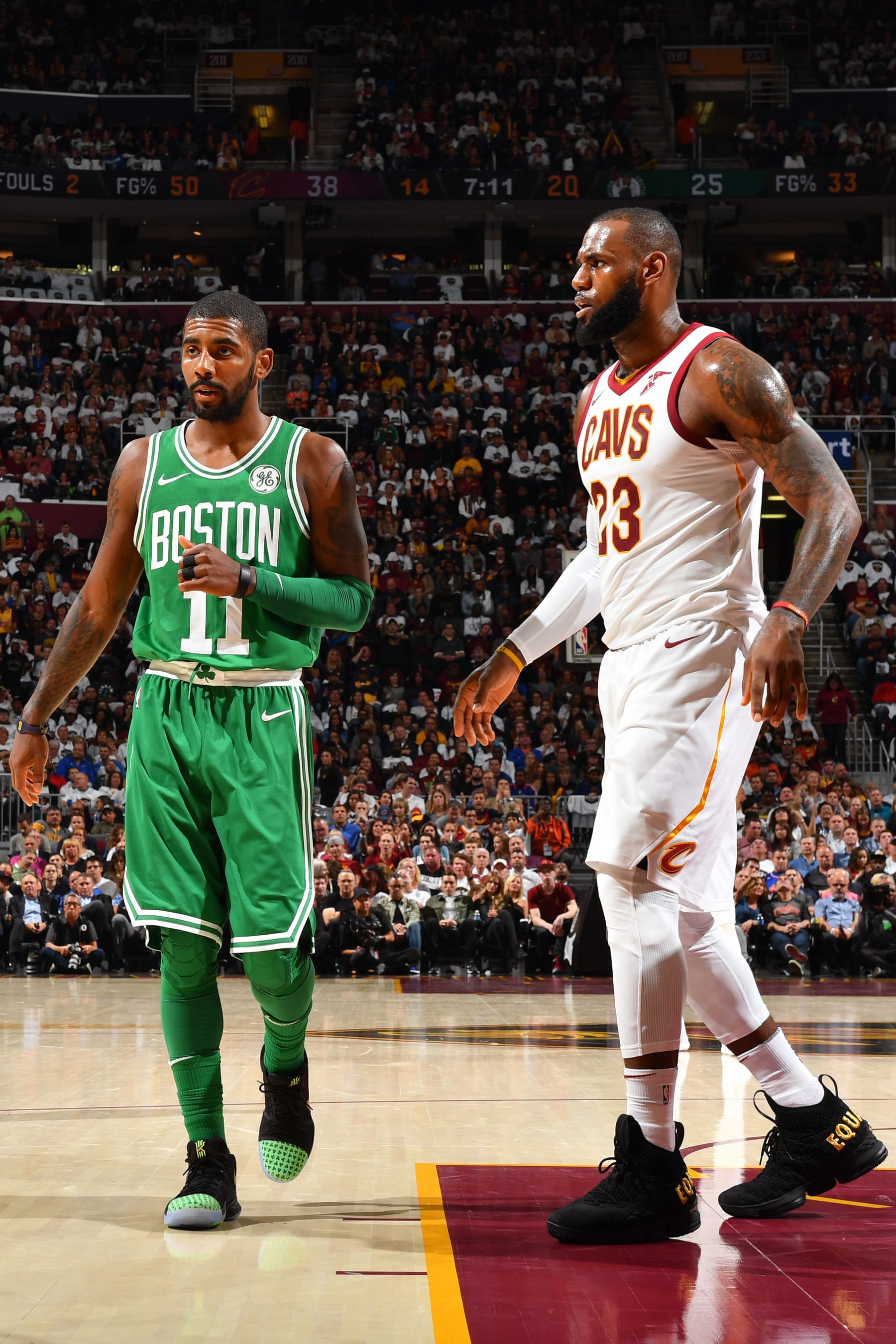 CLEVELAND, OH - OCTOBER 17:  LeBron James #23 of the Cleveland Cavaliers and Kyrie Irving #11 of the Boston Celtics walk on the court during the game on October 17, 2017 at Quicken Loans Arena in Cleveland, Ohio. NOTE TO USER: User expressly acknowledges and agrees that, by downloading and/or using this Photograph, user is consenting to the terms and conditions of the Getty Images License Agreement. Mandatory Copyright Notice: Copyright 2017 NBAE (Photo by Jesse D. Garrabrant/NBAE via Getty Images)