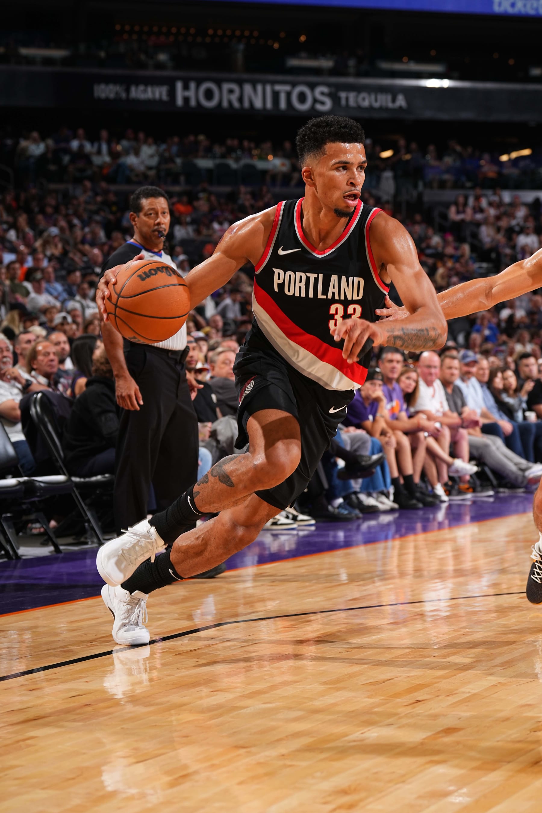 PHOENIX, AZ - OCTOBER 16: Toumani Camara #33 of the Portland Trail Blazers dribbles the ball during the game against the Phoenix Suns on October 16, 2023 at Footprint Center in Phoenix, Arizona. NOTE TO USER: User expressly acknowledges and agrees that, by downloading and or using this photograph, user is consenting to the terms and conditions of the Getty Images License Agreement. Mandatory Copyright Notice: Copyright 2023 NBAE (Photo by Garrett Ellwood/NBAE via Getty Images)