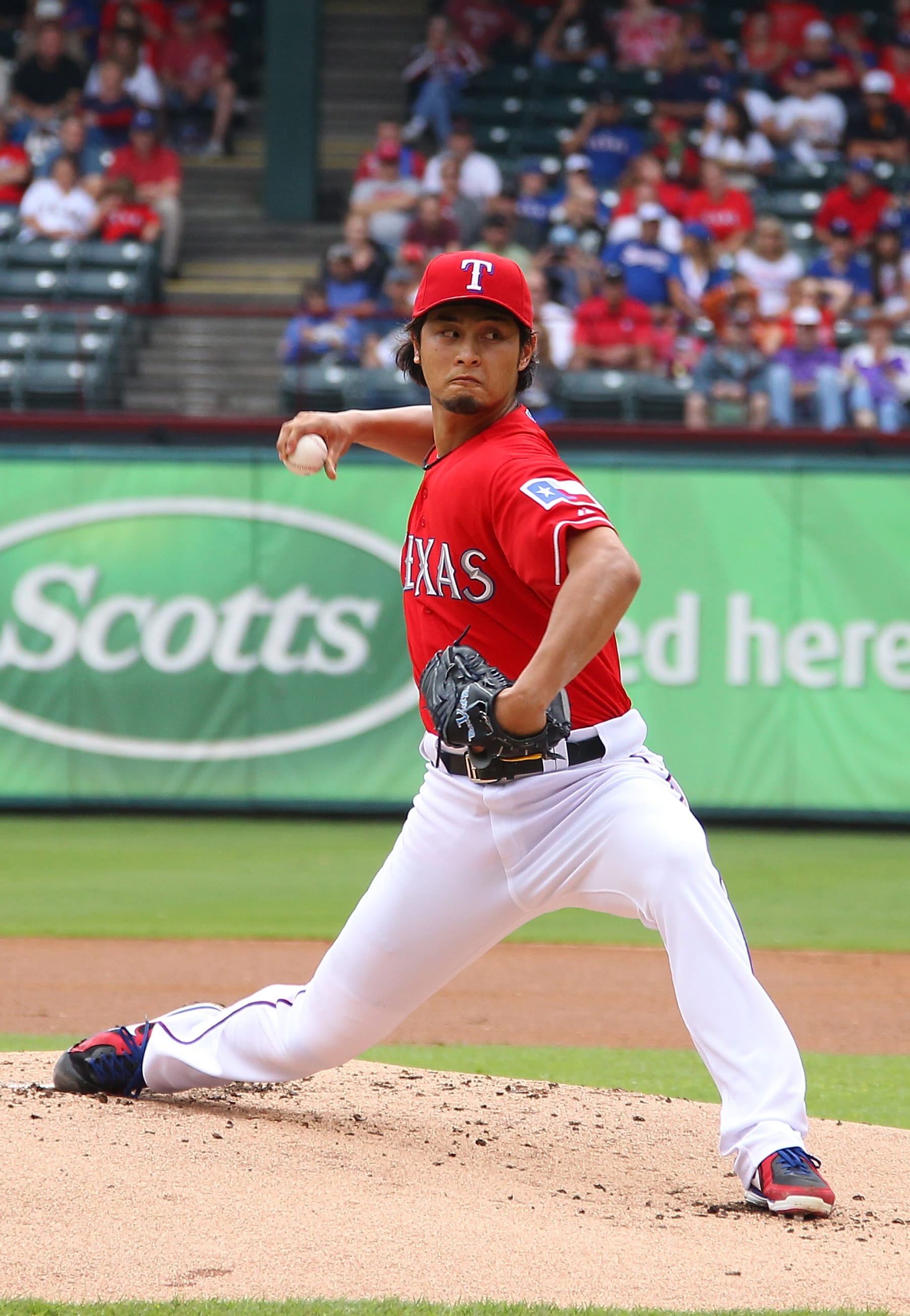 ARLINGTON, TX - SEPTEMBER 30: Yu Darvish #11 of the Texas Rangers pitches in game one of the double header against the Los Angeles Angels of Anaheim at Rangers Ballpark in Arlington on September 30, 2012 in Arlington, Texas.  (Photo by Rick Yeatts/Getty Images)