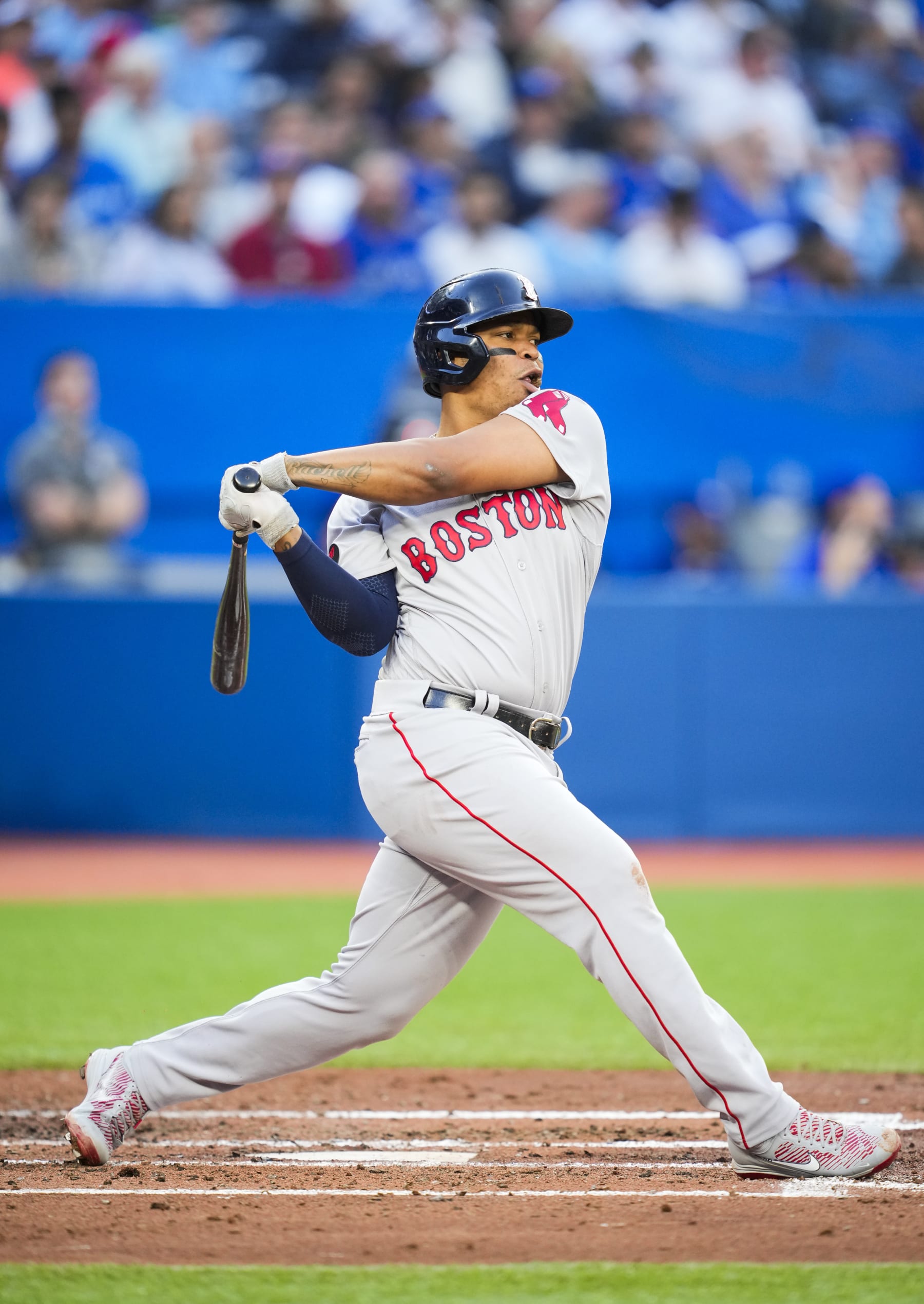 TORONTO, ON - JUNE 28: Rafael Devers #11 of the Boston Red Sox swings against the Toronto Blue Jays in the third inning during their MLB game at the Rogers Centre on June 28, 2022 in Toronto, Ontario, Canada. (Photo by Mark Blinch/Getty Images)