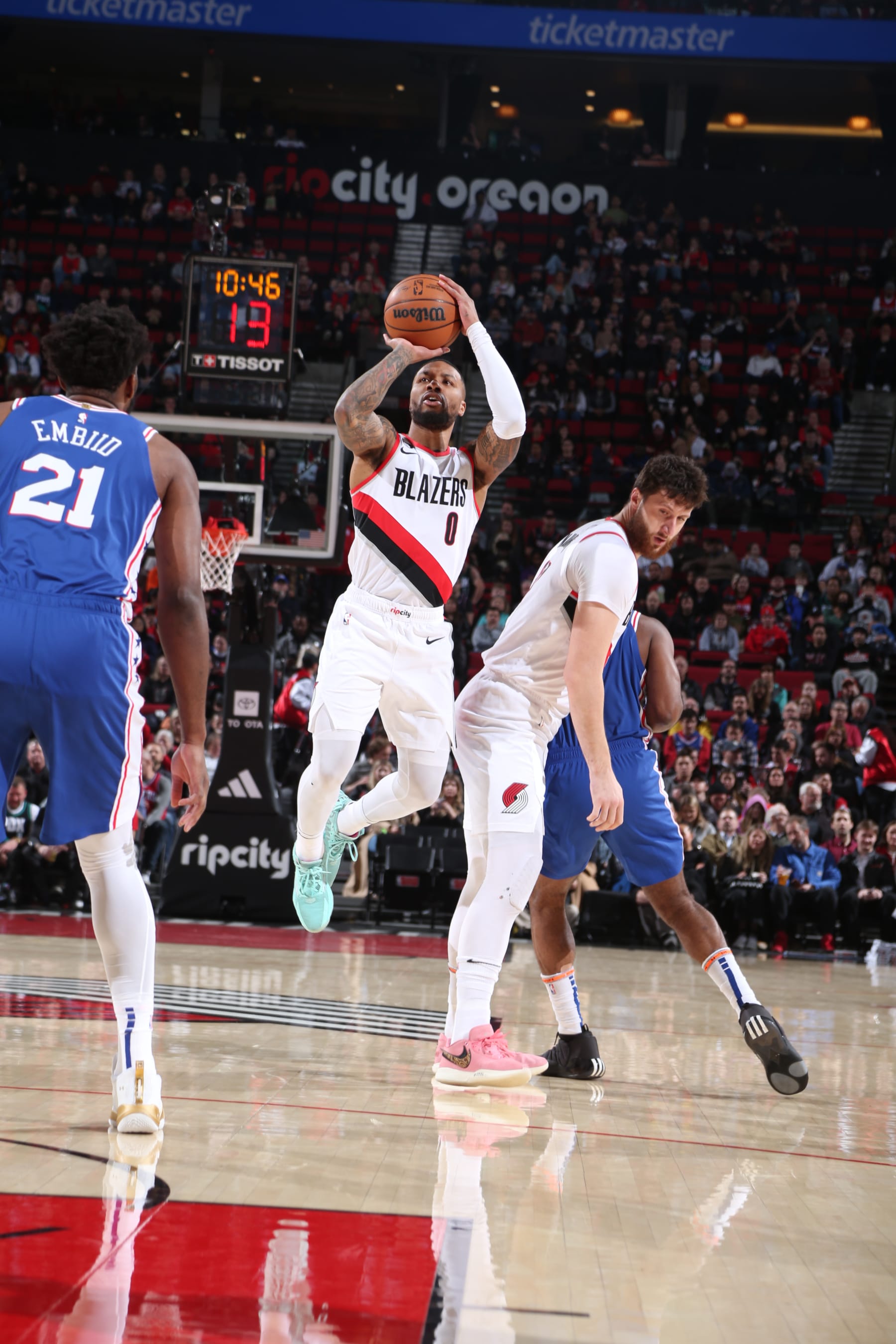 PORTLAND, OR - JANUARY 19: Damian Lillard #0 of the Portland Trail Blazers shoots a three point basket during the game against the Philadelphia 76ers on January 19, 2023 at the Moda Center Arena in Portland, Oregon. NOTE TO USER: User expressly acknowledges and agrees that, by downloading and or using this photograph, user is consenting to the terms and conditions of the Getty Images License Agreement. Mandatory Copyright Notice: Copyright 2023 NBAE (Photo by Sam Forencich/NBAE via Getty Images)