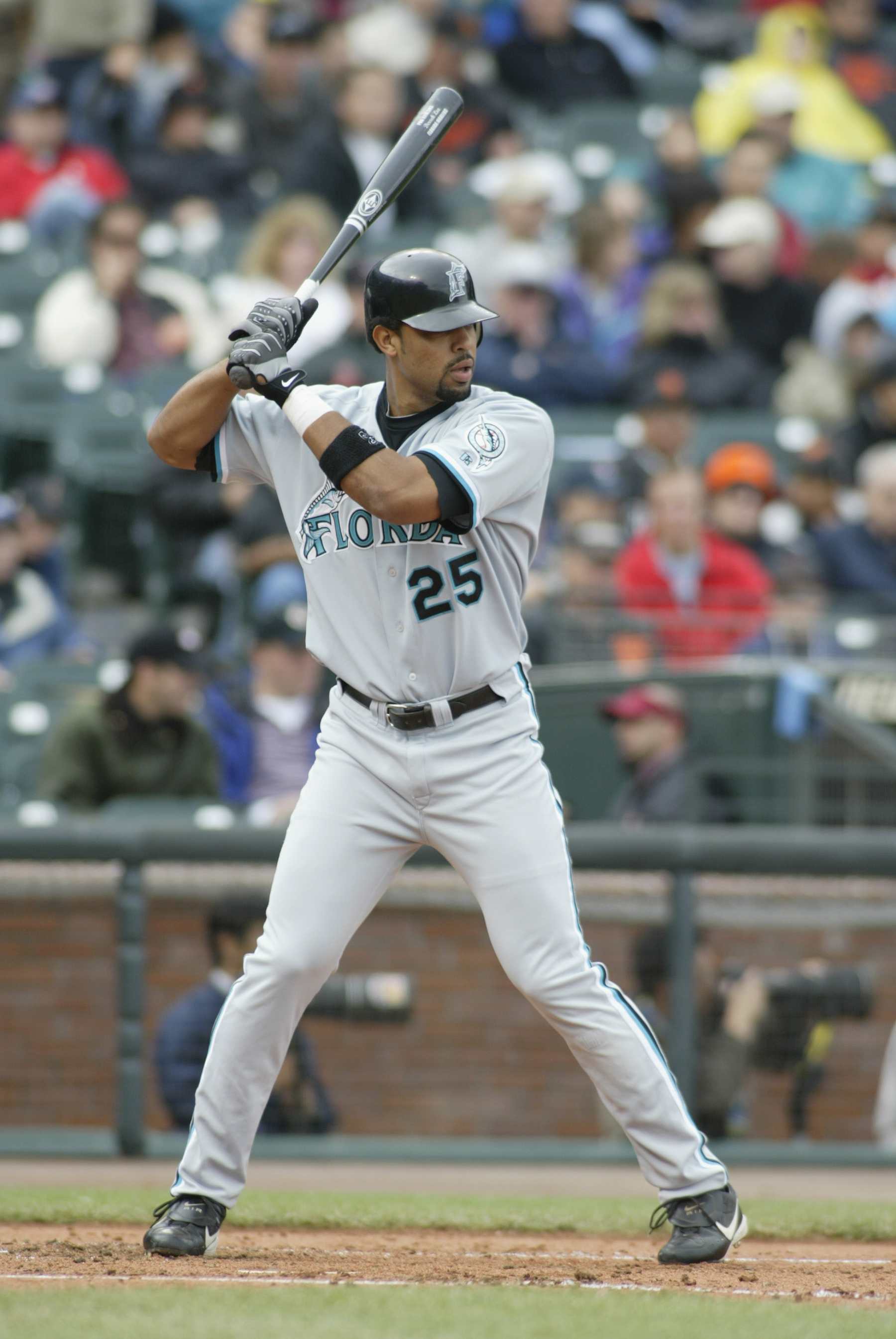 SAN FRANCISCO - MAY 19:  First baseman Derrek Lee #25 of the Florida Marlins waits for the pitch during the MLB game against the San Francisco Giants at Pacific Bell Park in San Francisco, California on May 19, 2002.  The Marlins won 4-2.  (Photo by Jed Jacobsohn/Getty Images)