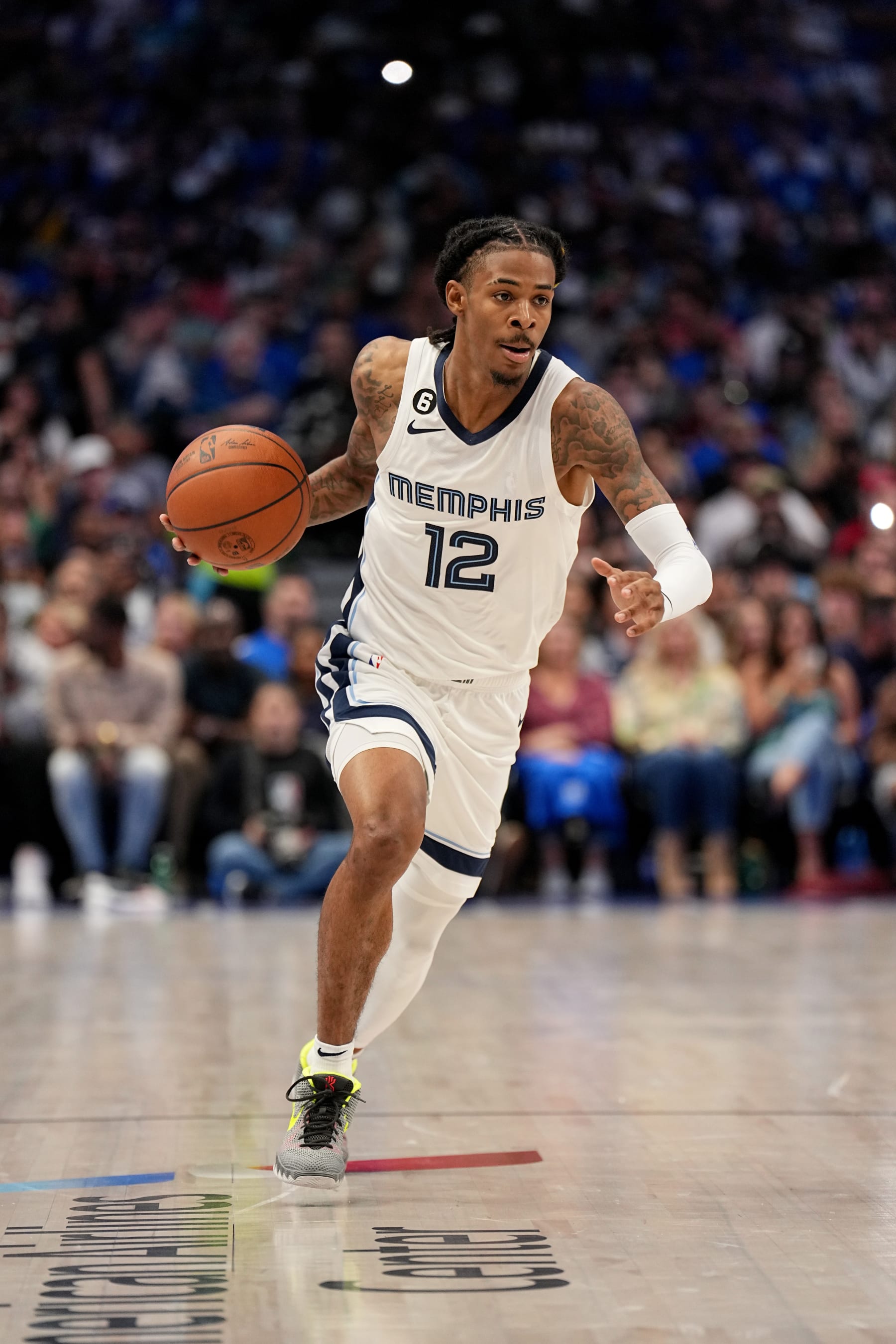 DALLAS, TX - OCTOBER 22: Ja Morant #12 of the Memphis Grizzlies drives to the basket against the Dallas Mavericks on October 22, 2022 at the American Airlines Center in Dallas, Texas. NOTE TO USER: User expressly acknowledges and agrees that, by downloading and or using this photograph, User is consenting to the terms and conditions of the Getty Images License Agreement. Mandatory Copyright Notice: Copyright 2022 NBAE (Photo by Glenn James/NBAE via Getty Images)