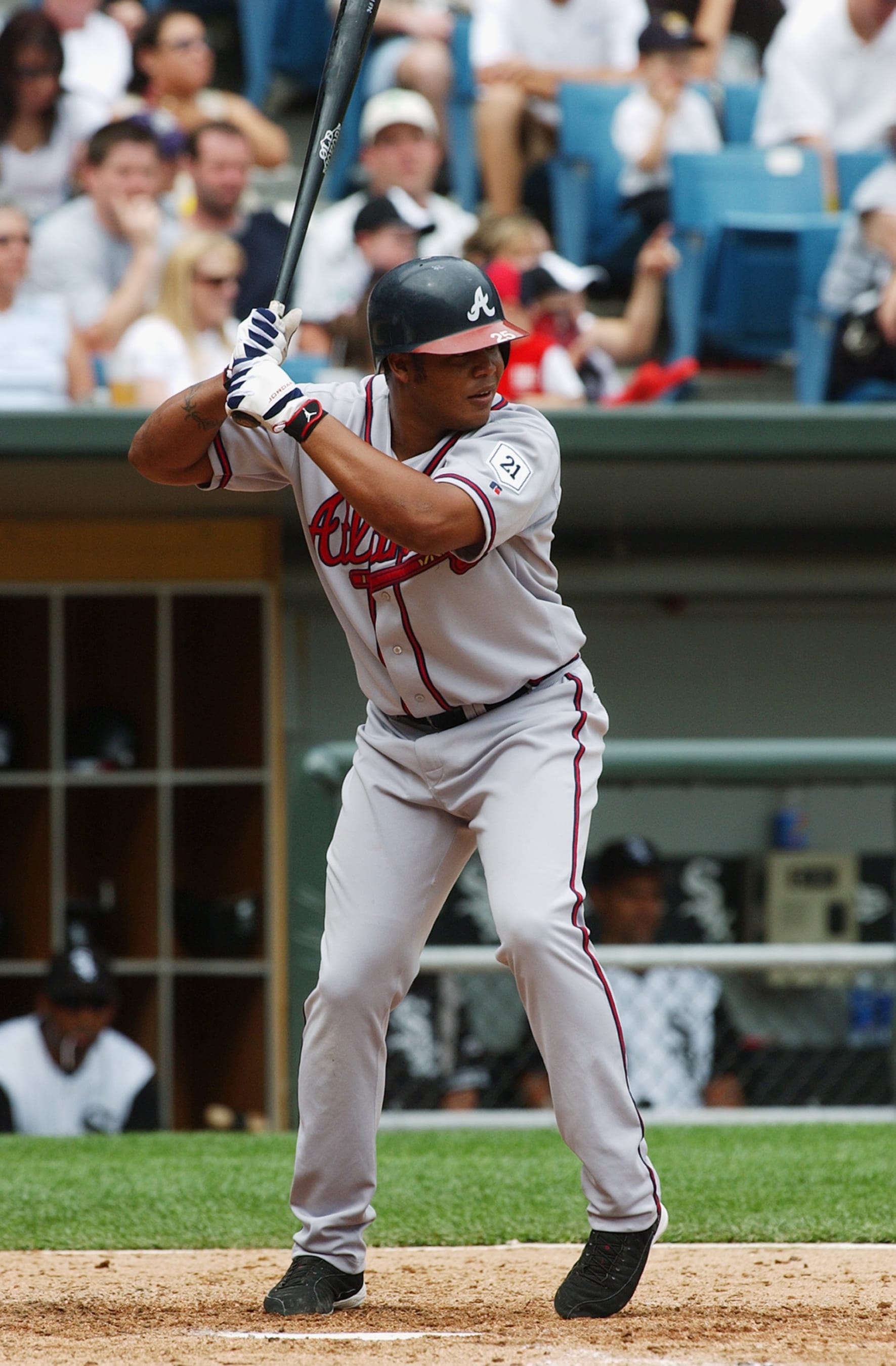 CHICAGO - JUNE 13:  Outfielder Andruw Jones #25 of the Atlanta Braves waits for a Chicago White Sox pitch during a game at U.S. Cellular Field on June 13, 2004 in Chicago, Illinois. The White Sox defeated the Braves 10-3. (Photo by Jonathan Daniel/Getty Images)