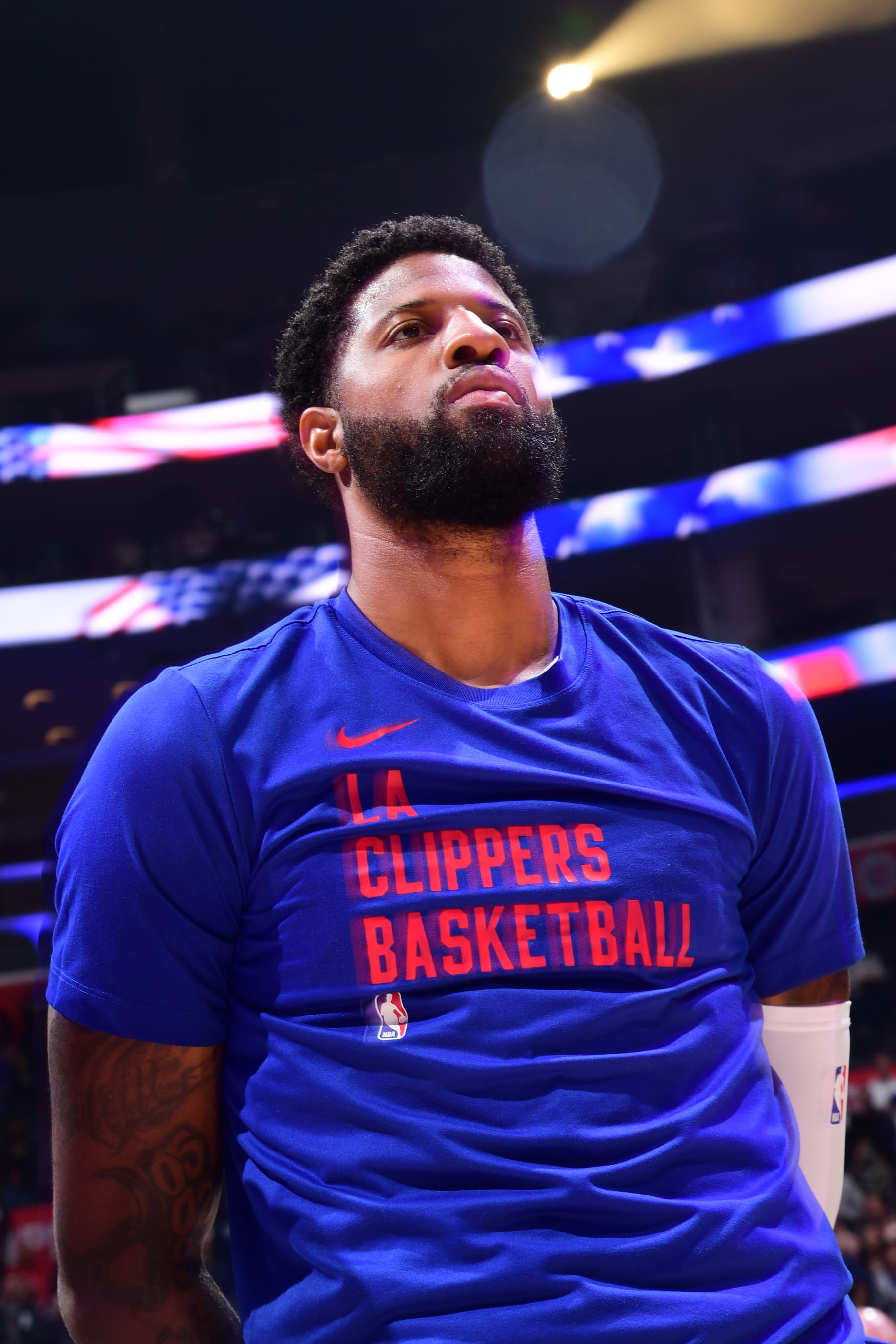 LOS ANGELES, CA - APRIL 12: Paul George #13 of the LA Clippers stands for the National Anthem before the game against the Utah Jazz on April 12, 2024 at Crypto.Com Arena in Los Angeles, California. NOTE TO USER: User expressly acknowledges and agrees that, by downloading and/or using this Photograph, user is consenting to the terms and conditions of the Getty Images License Agreement. Mandatory Copyright Notice: Copyright 2024 NBAE (Photo by Adam Pantozzi/NBAE via Getty Images)