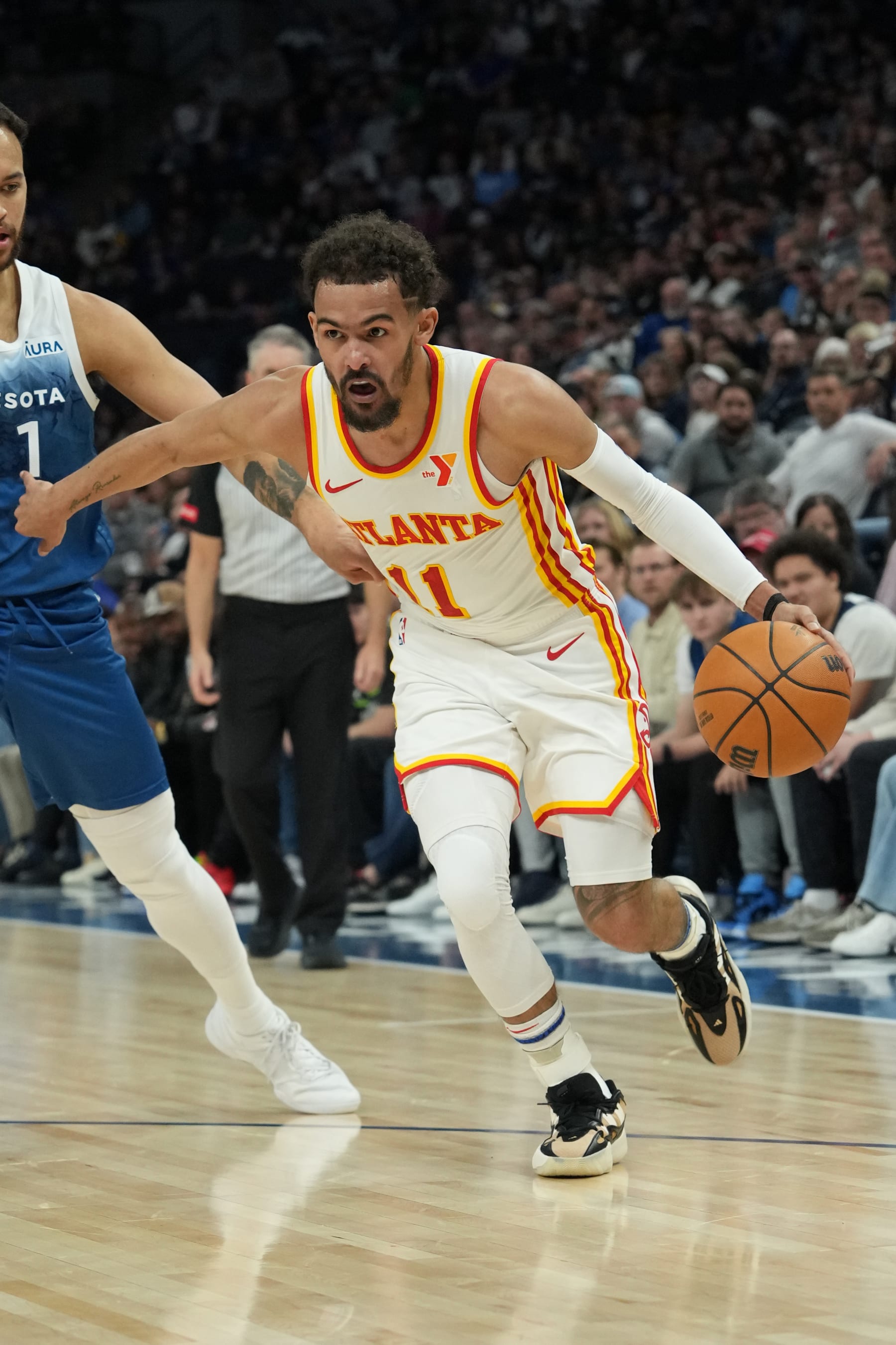 MINNEAPOLIS, MN -  APRIL 12: Trae Young #11 of the Atlanta Hawks handles the ball during the game against the Minnesota Timberwolves on April 12, 2024 at Target Center in Minneapolis, Minnesota. NOTE TO USER: User expressly acknowledges and agrees that, by downloading and or using this Photograph, user is consenting to the terms and conditions of the Getty Images License Agreement. Mandatory Copyright Notice: Copyright 2024 NBAE (Photo by Jordan Johnson/NBAE via Getty Images)