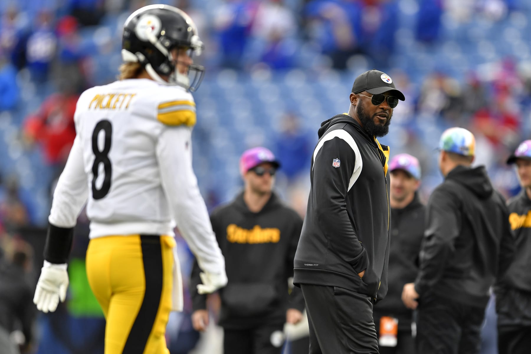 Pittsburgh Steelers quarterback Kenny Pickett (8) warms up with head coach Mike Tomlin, right, looking on before an NFL football game against the Buffalo Bills in Orchard Park, N.Y., Sunday, Oct. 9, 2022. (AP Photo/Adrian Kraus)