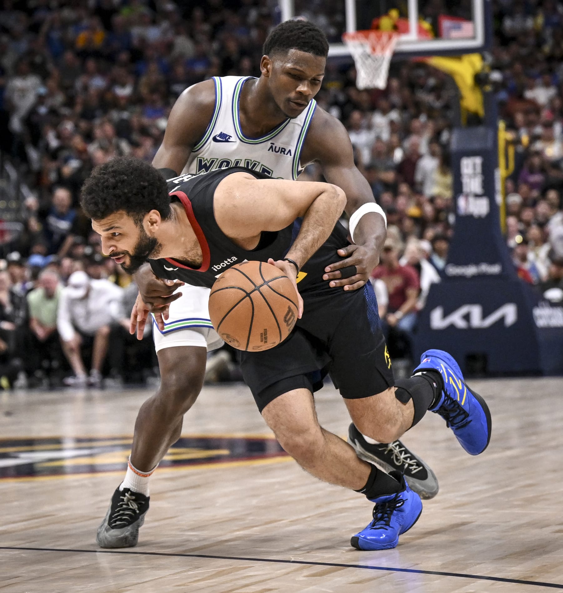 DENVER, CO - MAY 19: Jamal Murray (27) of the Denver Nuggets works as Anthony Edwards (5) of the Minnesota Timberwolves place tight defense during the fourth quarter of the T-Wolves' 98-90 win at Ball Arena in Denver on Sunday, May 19, 2024. (Photo by AAron Ontiveroz/The Denver Post)