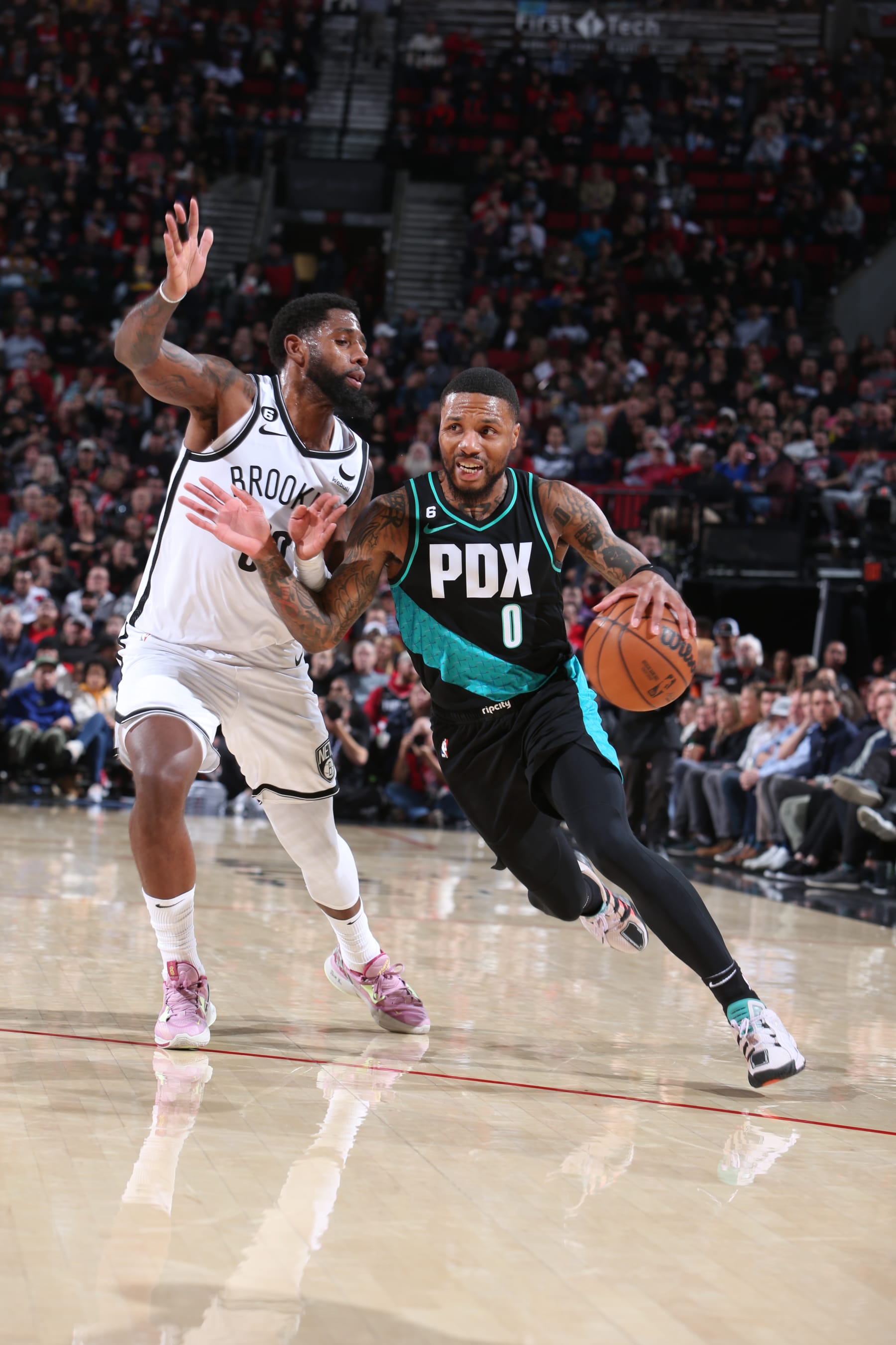 PORTLAND, OR - NOVEMBER 15: Damian Lillard #0 of the Portland Trail Blazers drives to the basket during the game against the Brooklyn Nets on November 15, 2022 at the Moda Center Arena in Portland, Oregon. NOTE TO USER: User expressly acknowledges and agrees that, by downloading and or using this photograph, user is consenting to the terms and conditions of the Getty Images License Agreement. Mandatory Copyright Notice: Copyright 2022 NBAE (Photo by Sam Forencich/NBAE via Getty Images)