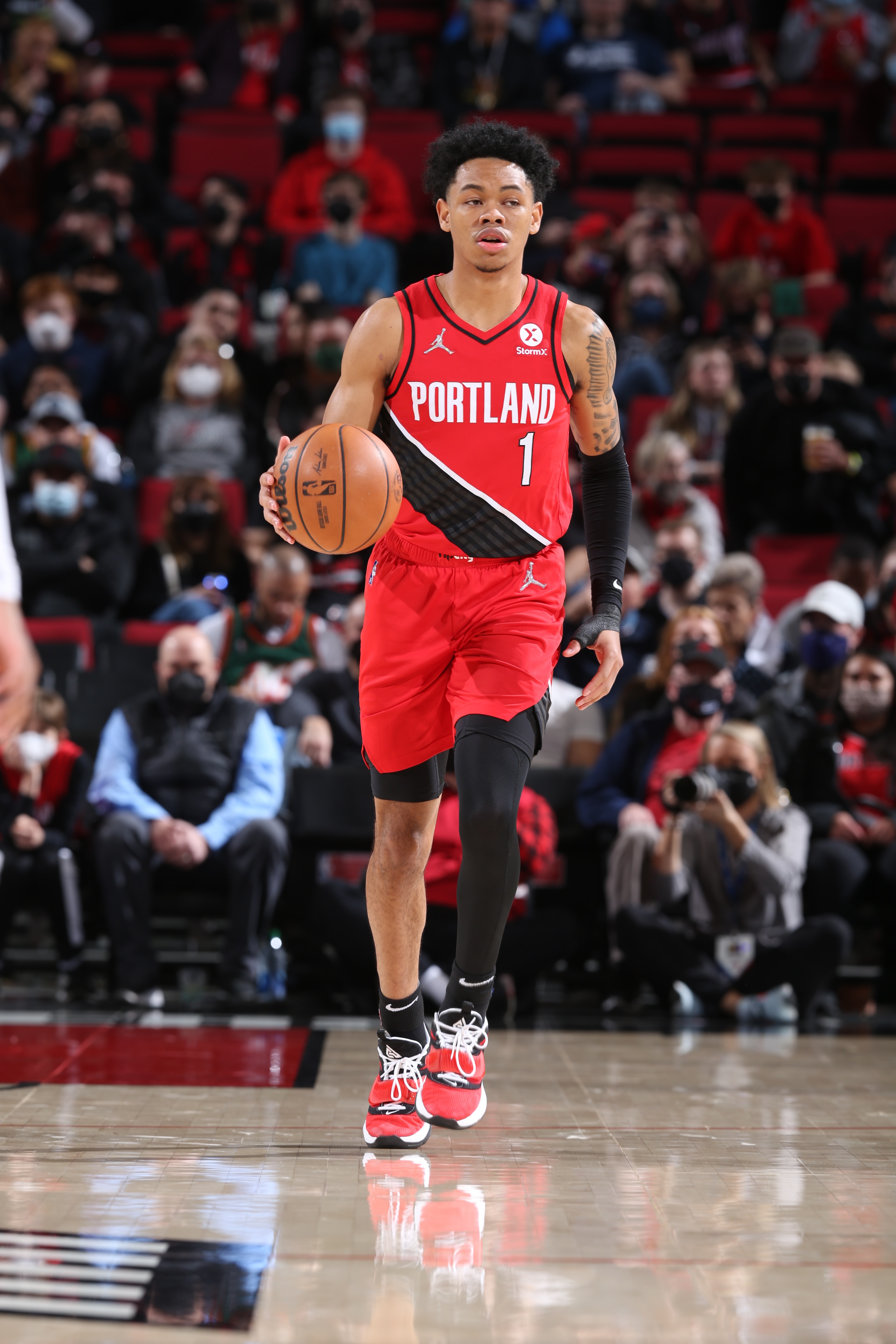 PORTLAND, OR - FEBRUARY 27: Anfernee Simons #1 of the Portland Trail Blazers dribbles the ball during the game against the Denver Nuggets on February 27, 2022 at the Moda Center Arena in Portland, Oregon. NOTE TO USER: User expressly acknowledges and agrees that, by downloading and or using this photograph, user is consenting to the terms and conditions of the Getty Images License Agreement. Mandatory Copyright Notice: Copyright 2022 NBAE (Photo by Sam Forencich/NBAE via Getty Images)