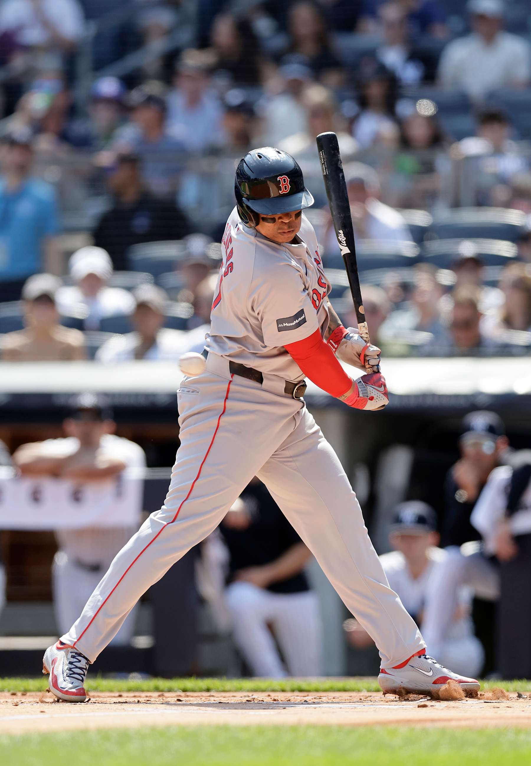 NEW YORK, NEW YORK - SEPTEMBER 14:  Rafael Devers #11 of the Boston Red Sox is hit by a pitch in the first inning against the New York Yankees at Yankee Stadium on September 14, 2024 in New York City. (Photo by Jim McIsaac/Getty Images)