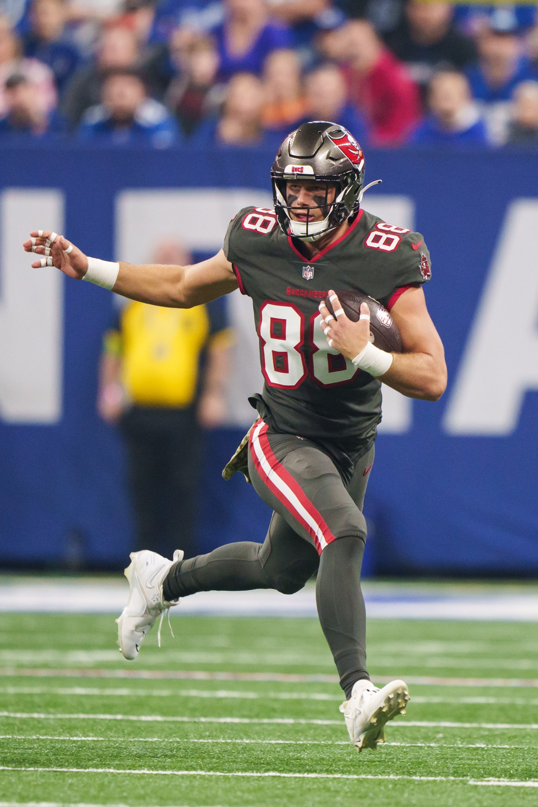 INDIANAPOLIS, IN - NOVEMBER 26:  Tight end Cade Otton #88 of the Tampa Bay Buccaneers runs the ball during an NFL football game against the Indianapolis Colts at Lucas Oil Stadium on November 26, 2023 in Indianapolis, Indiana. The Colts beat the Buccaneers 27-20. (Photo by Todd Rosenberg/Getty Images)
