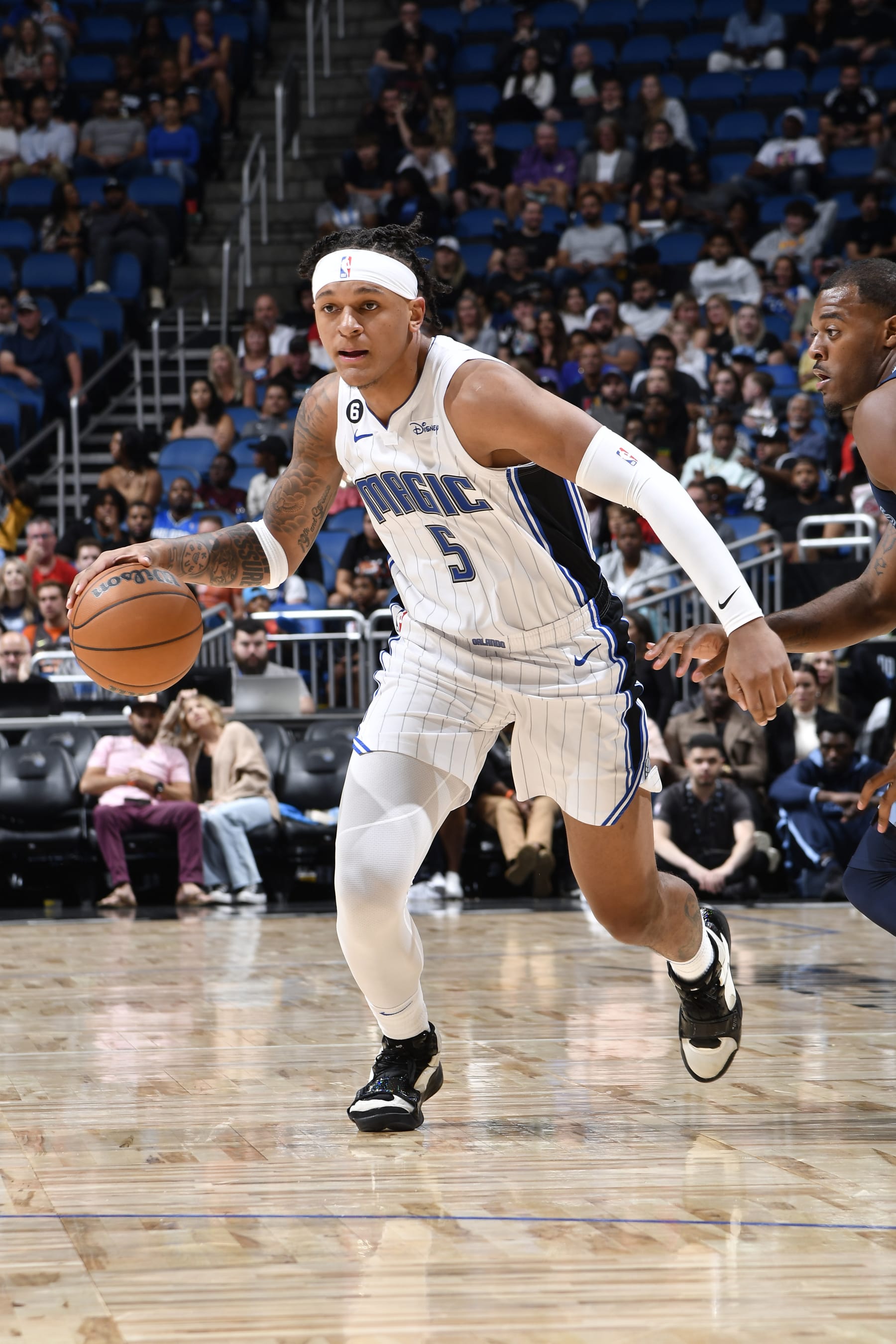 ORLANDO, FL - OCTOBER 11: Paolo Banchero #5 of the Orlando Magic drives to the basket during the game against the against the Memphis Grizzlies on October 11, 2022 at Amway Center in Orlando, Florida. NOTE TO USER: User expressly acknowledges and agrees that, by downloading and or using this photograph, User is consenting to the terms and conditions of the Getty Images License Agreement. Mandatory Copyright Notice: Copyright 2022 NBAE (Photo by Fernando Medina/NBAE via Getty Images)