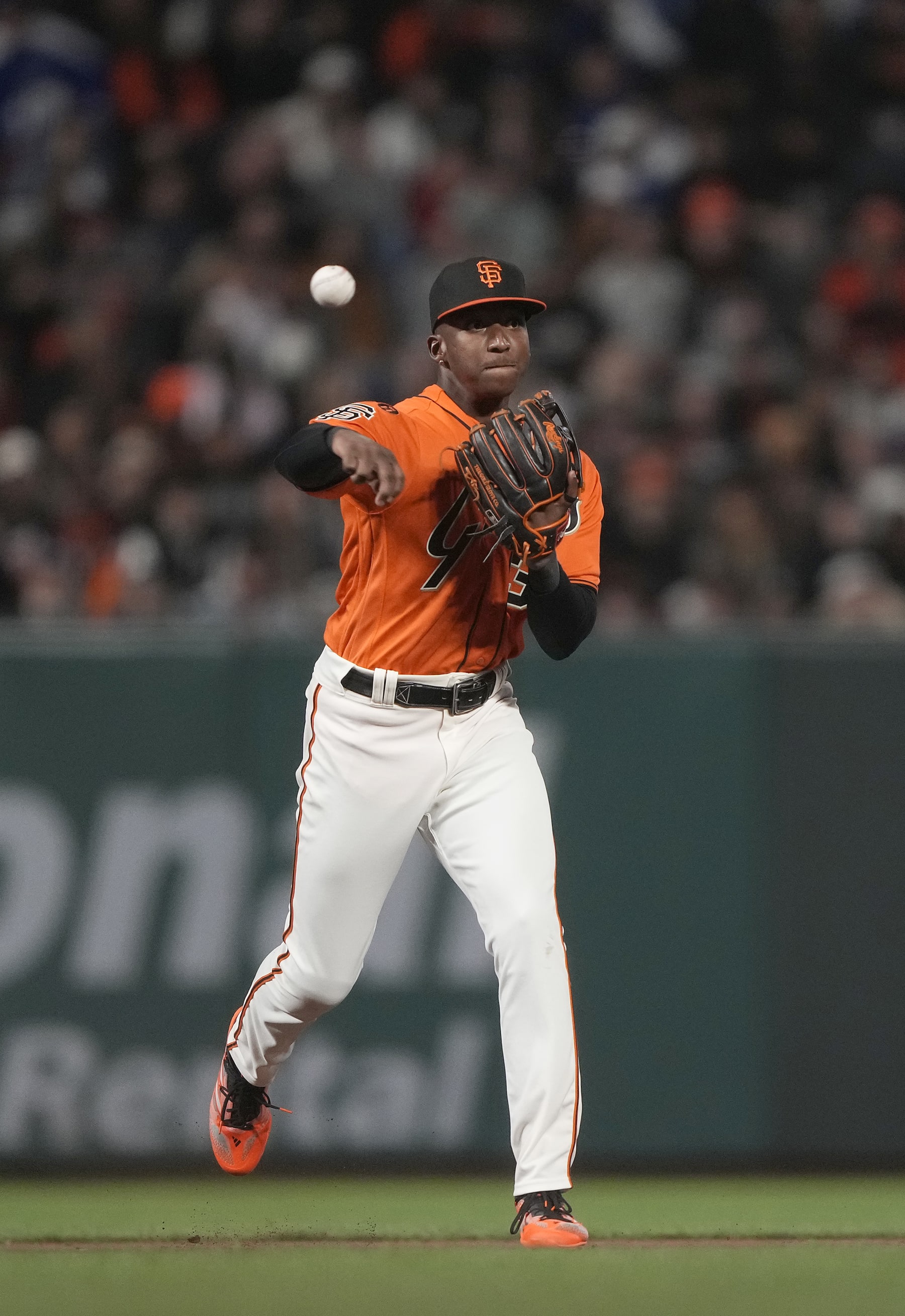 SAN FRANCISCO, CALIFORNIA - SEPTEMBER 29: Marco Luciano #37 of the San Francisco Giants throws to first base throwing out Enrique Hernandez #8 of the Los Angeles Dodgers in the top of the ninth inning at Oracle Park on September 29, 2023 in San Francisco, California. (Photo by Thearon W. Henderson/Getty Images)