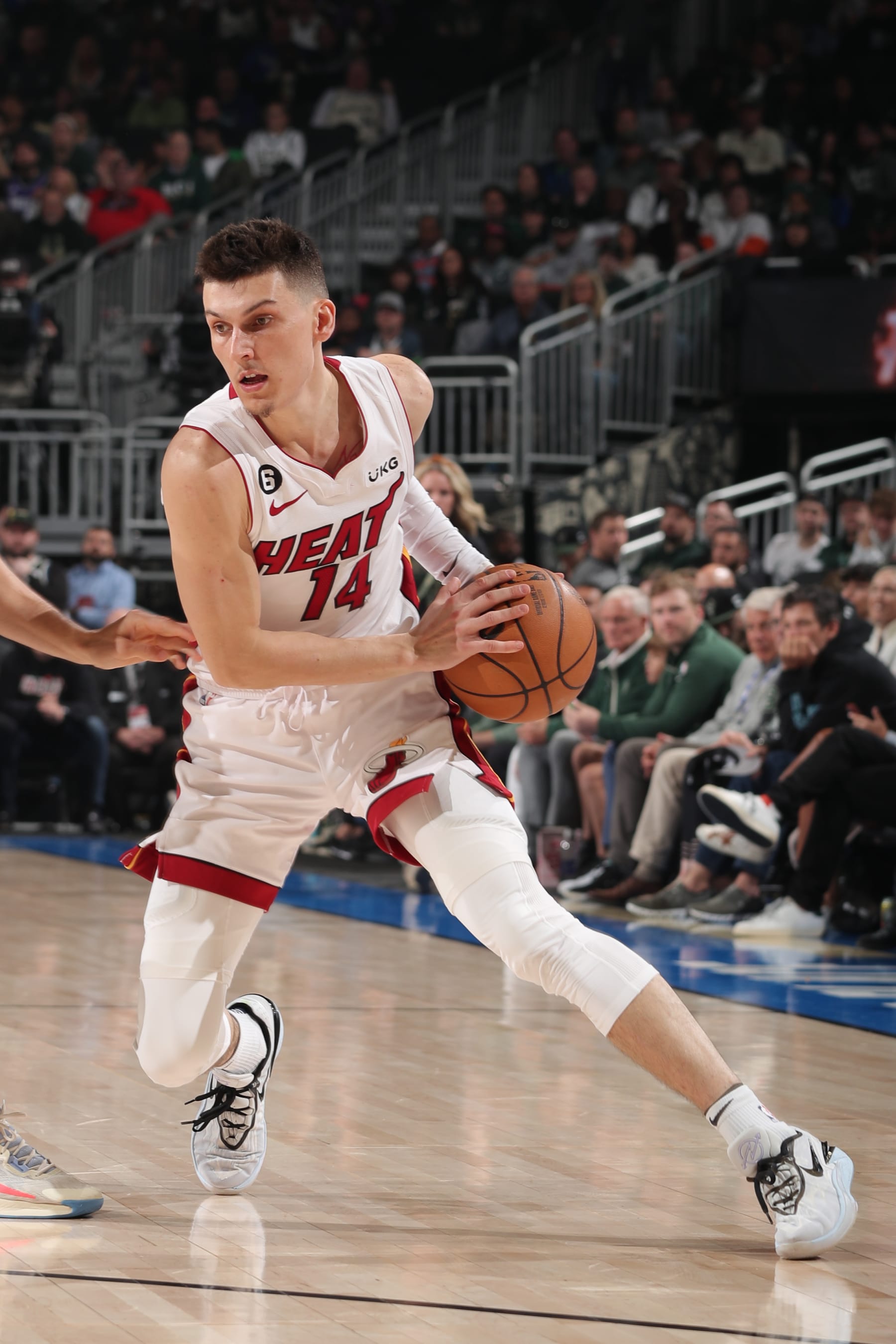 MILWAUKEE, WI - APRIL 16: Tyler Herro #14 of the Miami Heat dribbles the ball during the game against the Milwaukee Bucks during Round One Game One of the 2023 NBA Playoffs on April 16, 2023 at the Fiserv Forum Center in Milwaukee, Wisconsin. NOTE TO USER: User expressly acknowledges and agrees that, by downloading and or using this Photograph, user is consenting to the terms and conditions of the Getty Images License Agreement. Mandatory Copyright Notice: Copyright 2023 NBAE (Photo by Gary Dineen/NBAE via Getty Images).