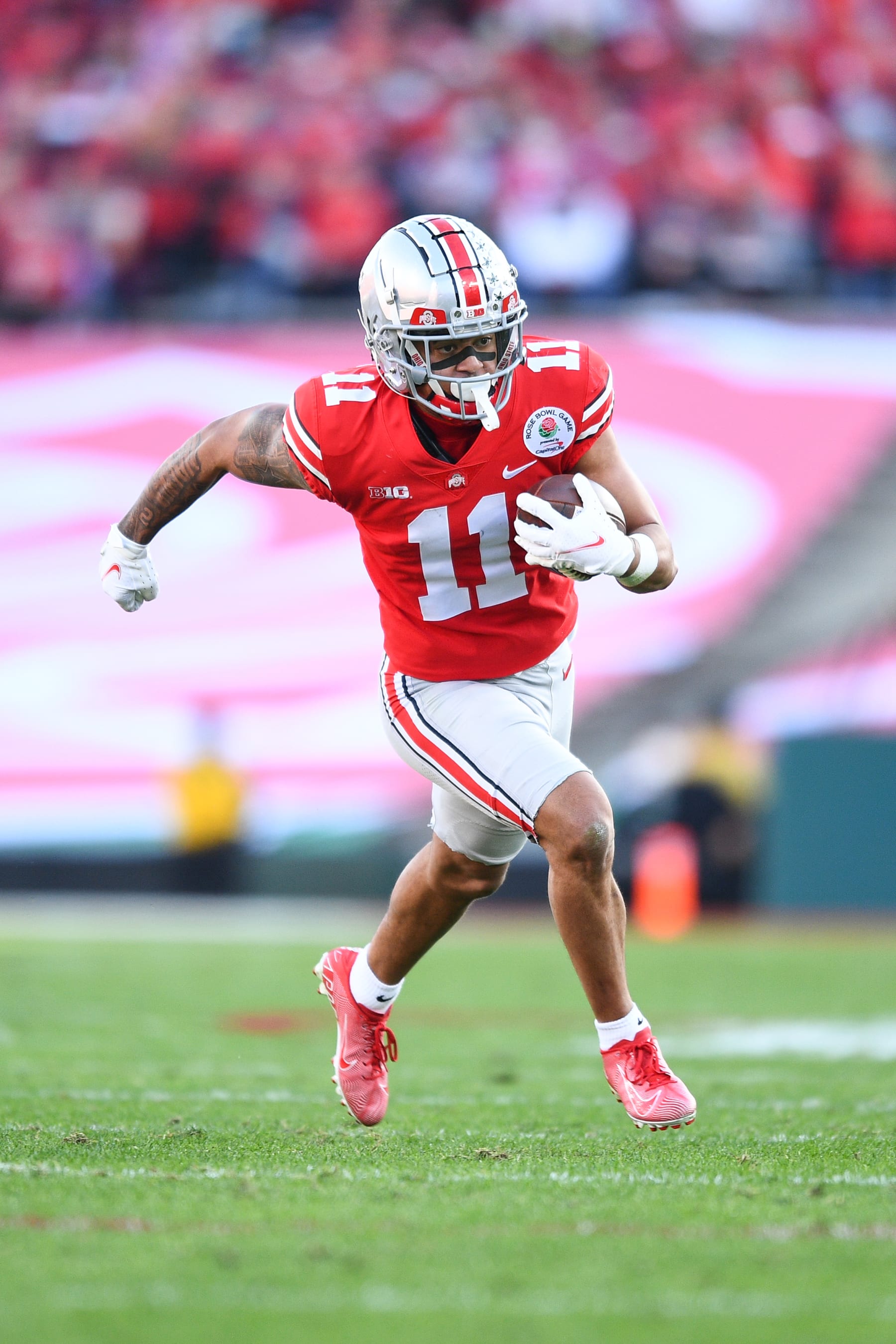 PASADENA, CA - JANUARY 01: Ohio State Buckeyes wide receiver Jaxon Smith-Njigba (11) runs up field during the Rose Bowl game between the Ohio State Buckeyes and the Utah Utes on January 1, 2022 at the Rose Bowl in Pasadena, CA. (Photo by Brian Rothmuller/Icon Sportswire via Getty Images)