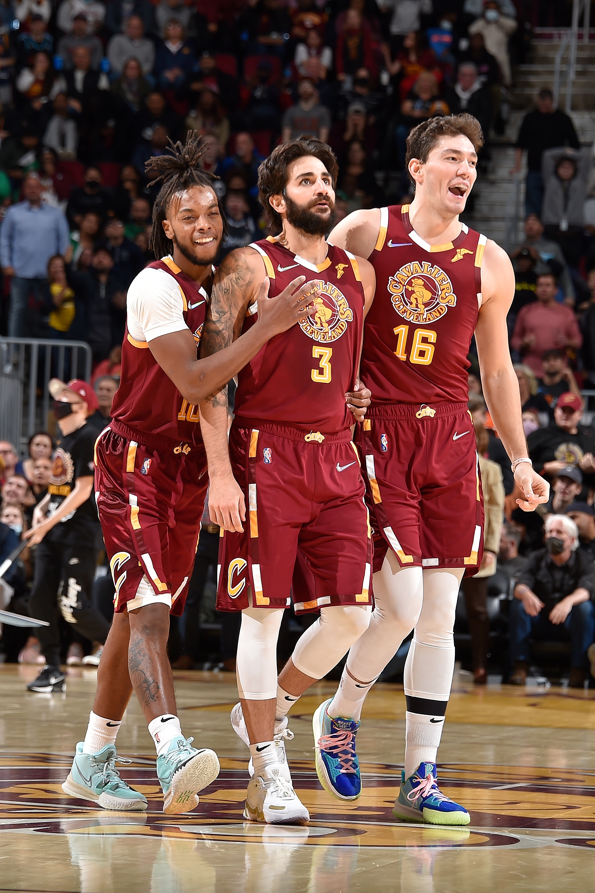 CLEVELAND, OH - NOVEMBER 13: Darius Garland #10 Ricky Rubio #3 and Cedi Osman #16 of the Cleveland Cavaliers react to a play during the game against the Boston Celtics on November 13, 2021 at Rocket Mortgage FieldHouse in Cleveland, Ohio. NOTE TO USER: User expressly acknowledges and agrees that, by downloading and/or using this Photograph, user is consenting to the terms and conditions of the Getty Images License Agreement. Mandatory Copyright Notice: Copyright 2021 NBAE (Photo by David Liam Kyle/NBAE via Getty Images)