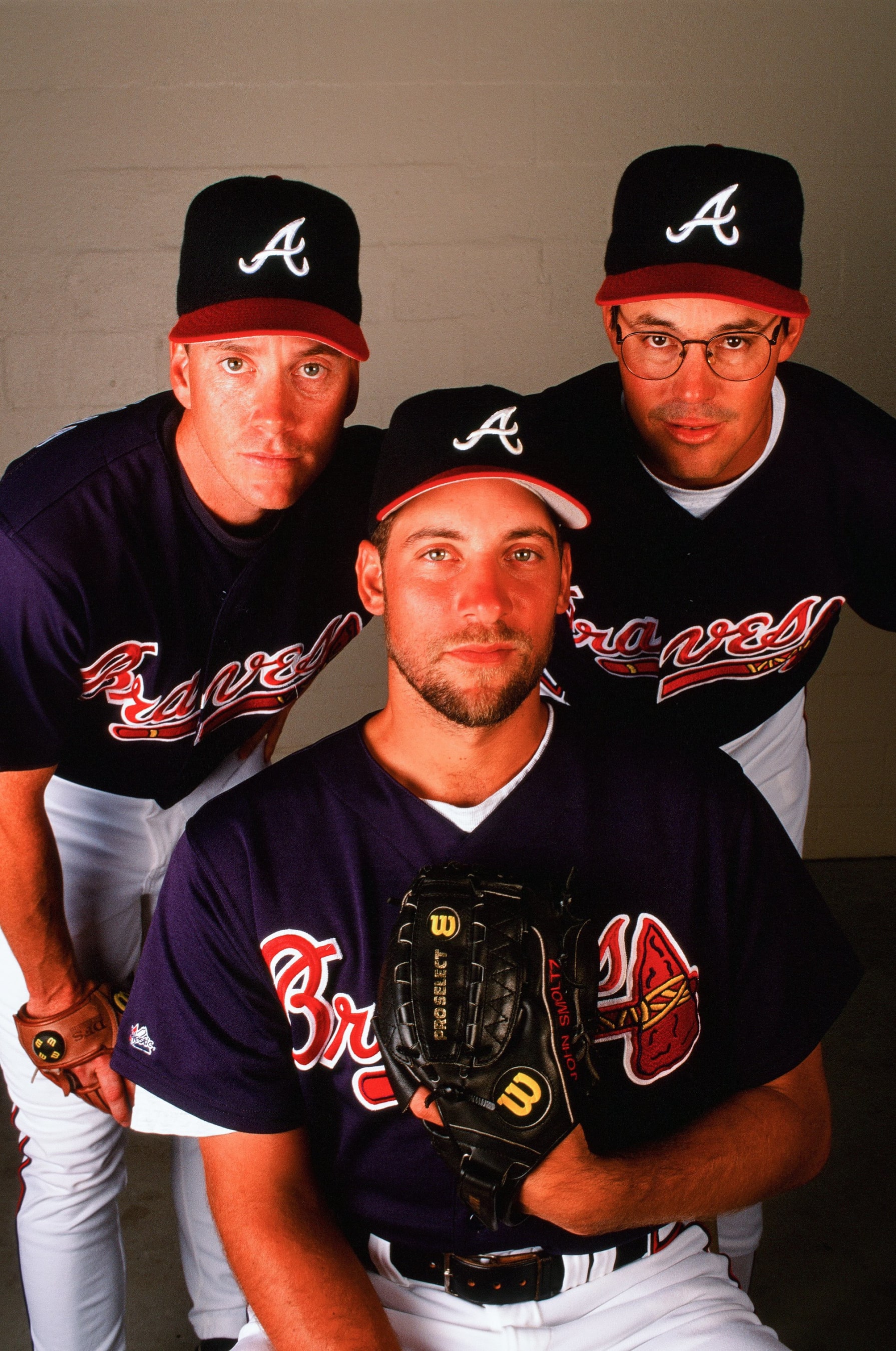 MARCH 20:  Tom Glavine, John Smoltz, and Greg Maddux of the Atlanta Braves pose for a portrait during Spring Training on March 20, 1997. (Photo by Sporting News via Getty Images via Getty Images) 