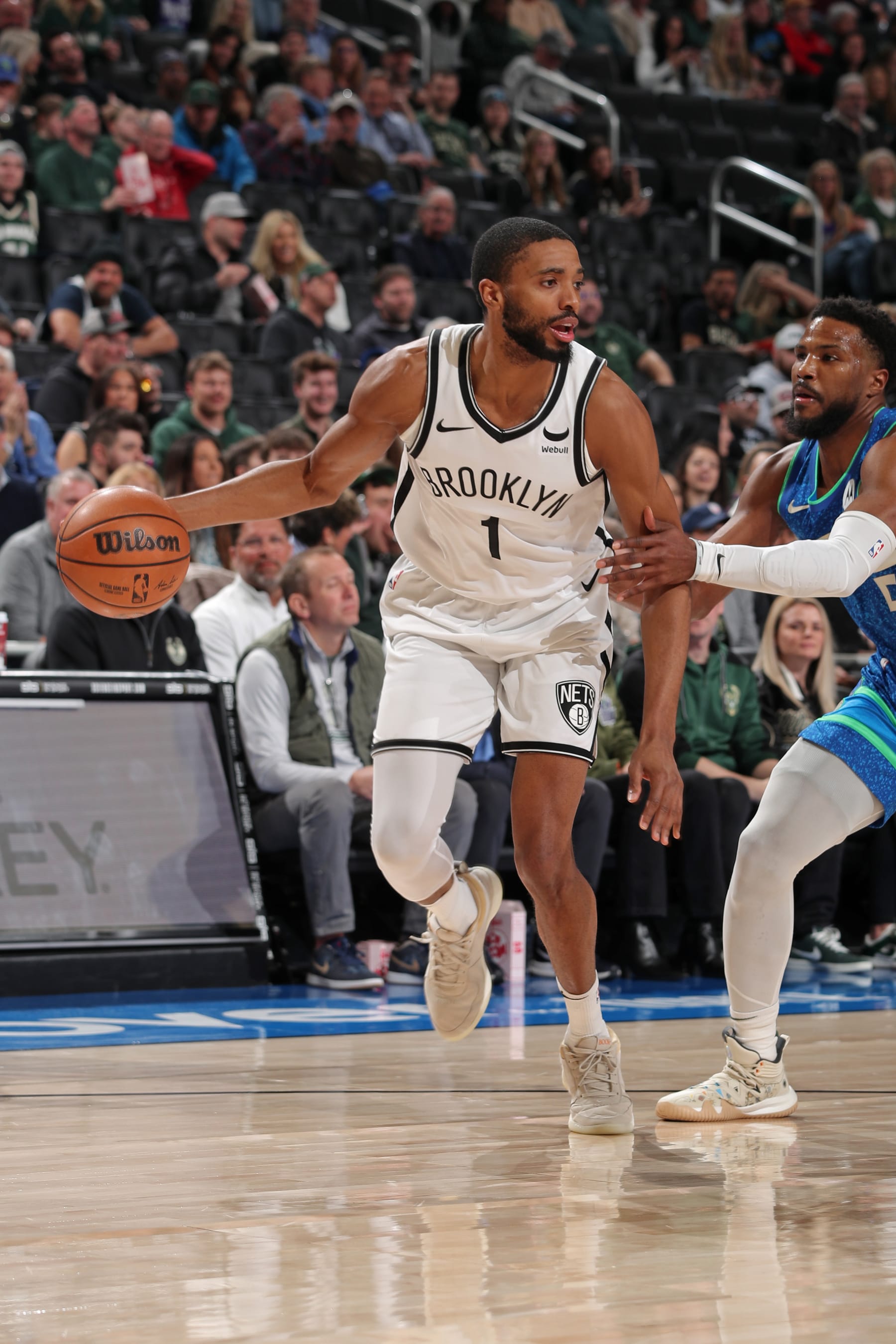 MILWAUKEE, WI - MARCH 21: Mikal Bridges #1 of the Brooklyn Nets handles the ball during the game against the Milwaukee Bucks on March 21, 2024 at the Fiserv Forum Center in Milwaukee, Wisconsin. NOTE TO USER: User expressly acknowledges and agrees that, by downloading and or using this Photograph, user is consenting to the terms and conditions of the Getty Images License Agreement. Mandatory Copyright Notice: Copyright 2024 NBAE (Photo by Gary Dineen/NBAE via Getty Images).
