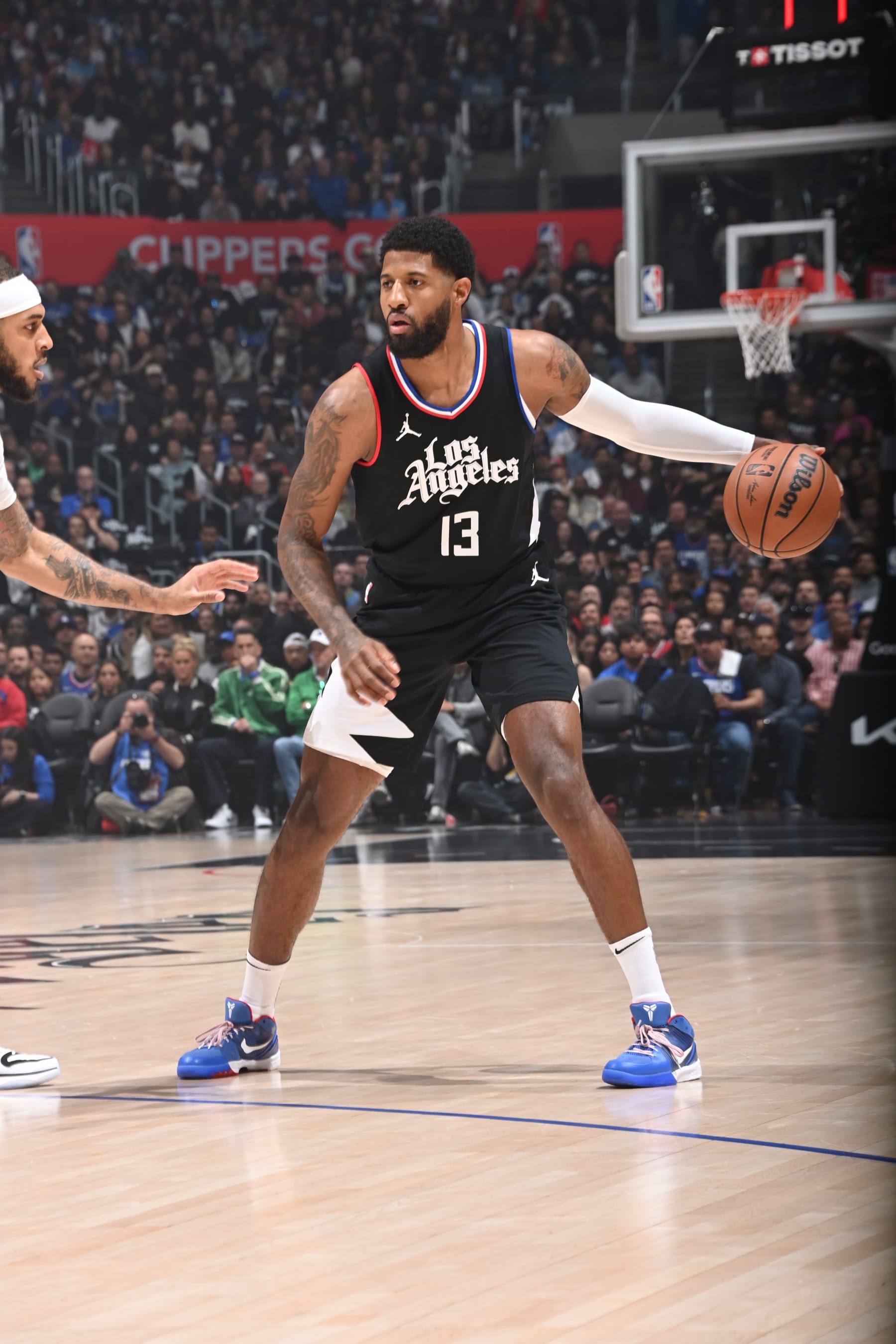 LOS ANGELES, CA - APRIL 23: Paul George #13 of the LA Clippers dribbles the ball during the game against the Dallas Mavericks during Round 1 Game 2 of the 2024 NBA Playoffs on April 23, 2024 at Crypto.Com Arena in Los Angeles, California. NOTE TO USER: User expressly acknowledges and agrees that, by downloading and/or using this Photograph, user is consenting to the terms and conditions of the Getty Images License Agreement. Mandatory Copyright Notice: Copyright 2024 NBAE (Photo by Andrew D. Bernstein/NBAE via Getty Images)