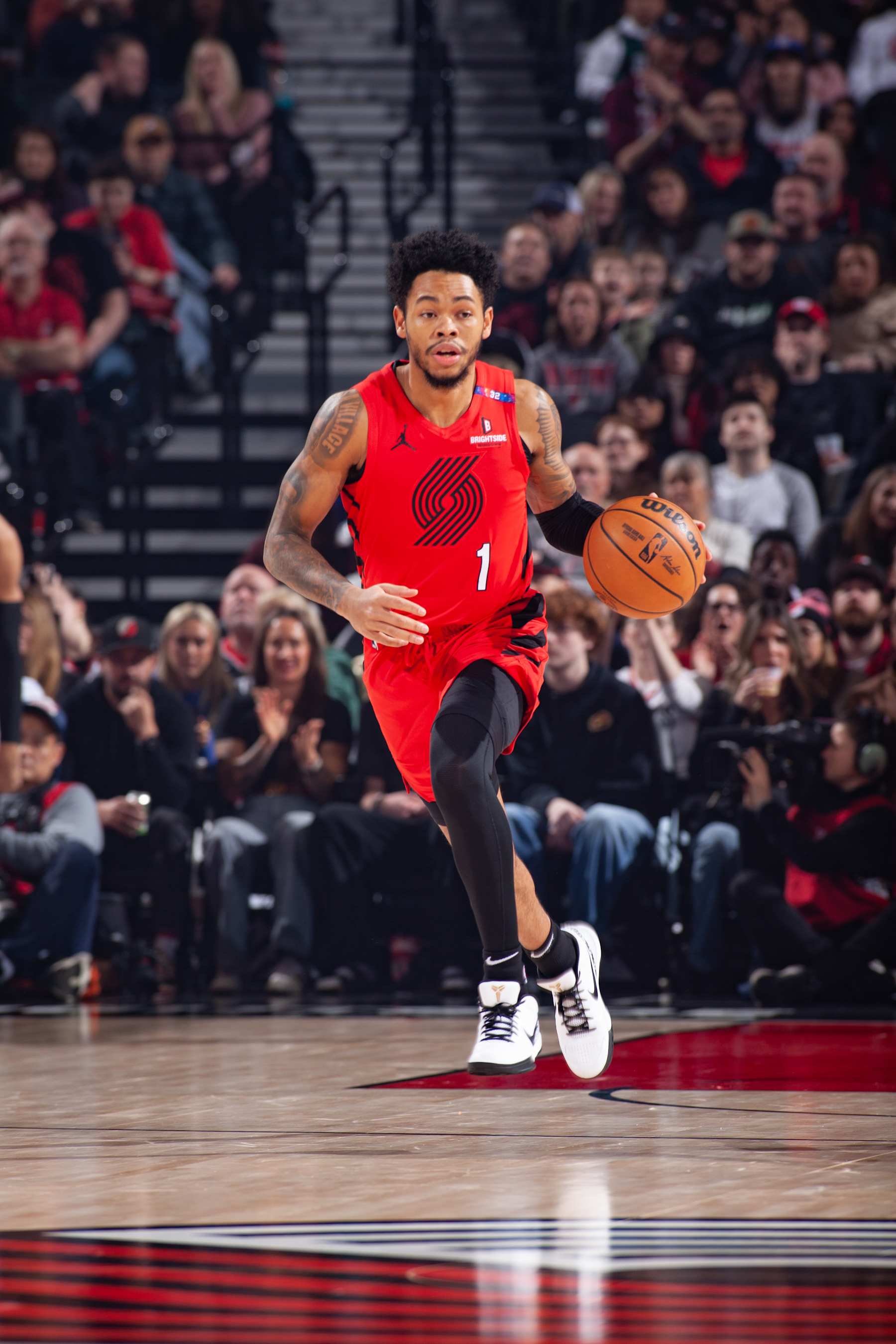 PORTLAND, OR - DECEMBER 30: Anfernee Simons #1 of the Portland Trail Blazers brings the ball up court during the game against the Philadelphia 76ers on December 30, 2024 at the Moda Center Arena in Portland, Oregon. NOTE TO USER: User expressly acknowledges and agrees that, by downloading and or using this photograph, user is consenting to the terms and conditions of the Getty Images License Agreement. Mandatory Copyright Notice: Copyright 2024 NBAE (Photo by Cameron Browne/NBAE via Getty Images)