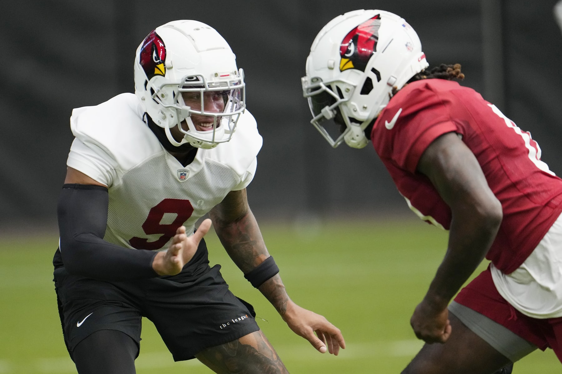 Arizona Cardinals linebacker Isaiah Simmons (9) covers Cardinals wide receiver Zach Pascal during NFL football training camp practice at State Farm Stadium Saturday, July 29, 2023, in Glendale, Ariz. (AP Photo/Ross D. Franklin)