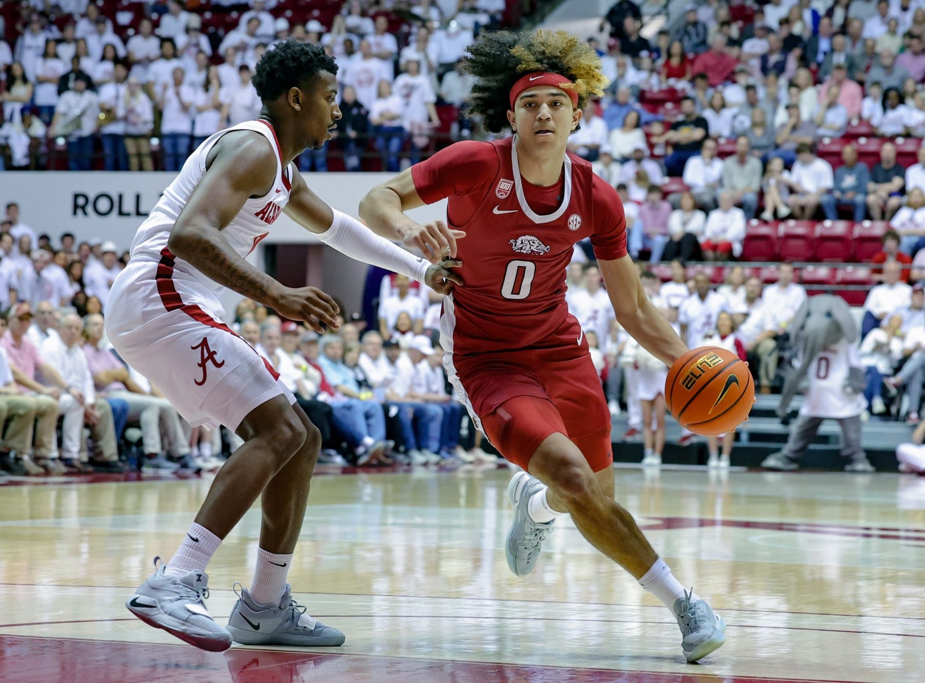 TUSCALOOSA, AL - FEBRUARY 25: Anthony Black #0 of the Arkansas Razorbacks drives to the basket during the first half against Jaden Bradley #0 of the Alabama Crimson Tide at Coleman Coliseum on February 25, 2023 in Tuscaloosa, Alabama. (Photo by Brandon Sumrall/Getty Images)