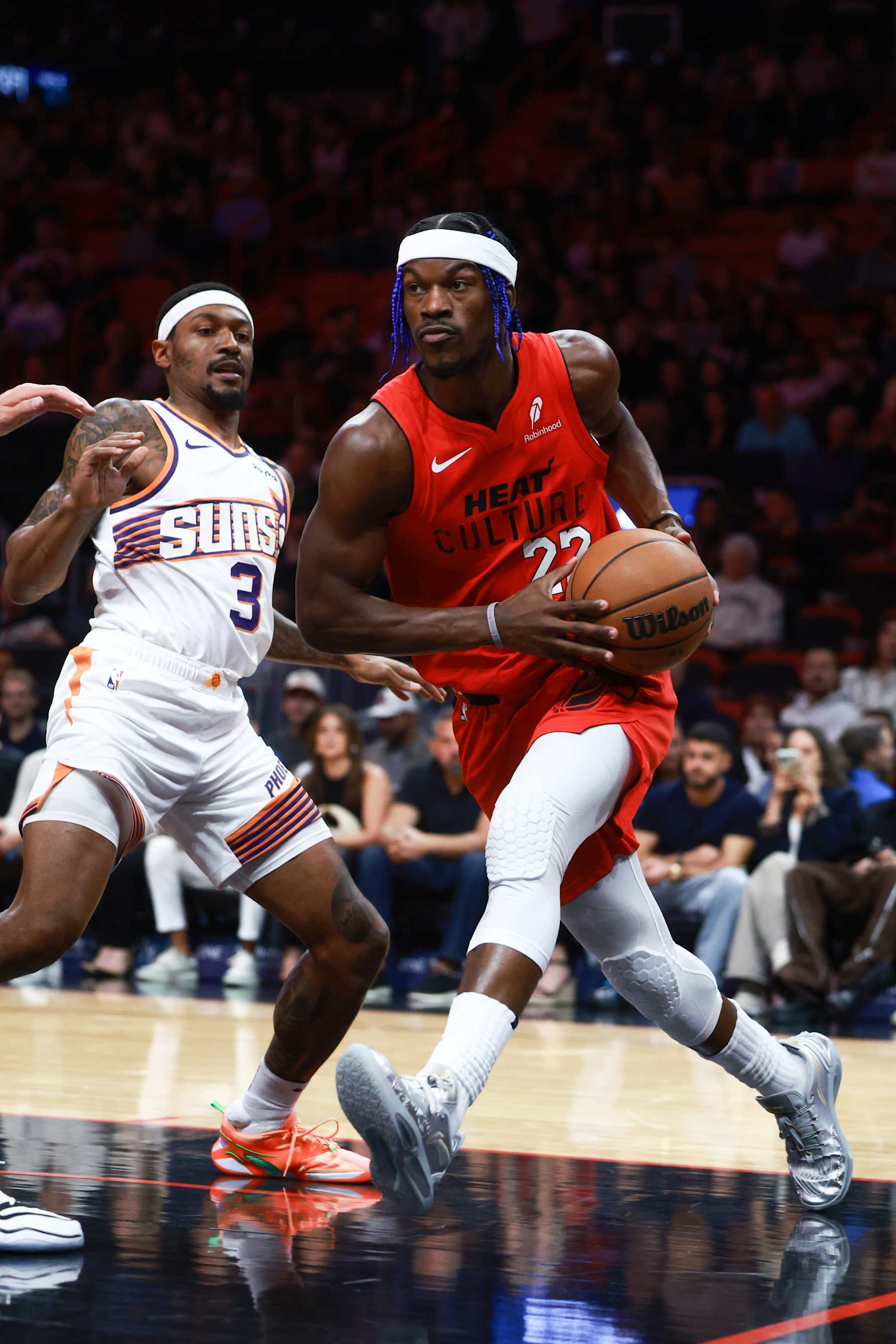 MIAMI, FLORIDA - DECEMBER 07: Jimmy Butler #22 of the Miami Heat drives around Bradley Beal #3 of the Phoenix Suns during the first half at Kaseya Center on December 07, 2024 in Miami, Florida. NOTE TO USER: User expressly acknowledges and agrees that, by downloading and or using this Photograph, user is consenting to the terms and conditions of the Getty Images License Agreement. (Photo by Carmen Mandato/Getty Images)