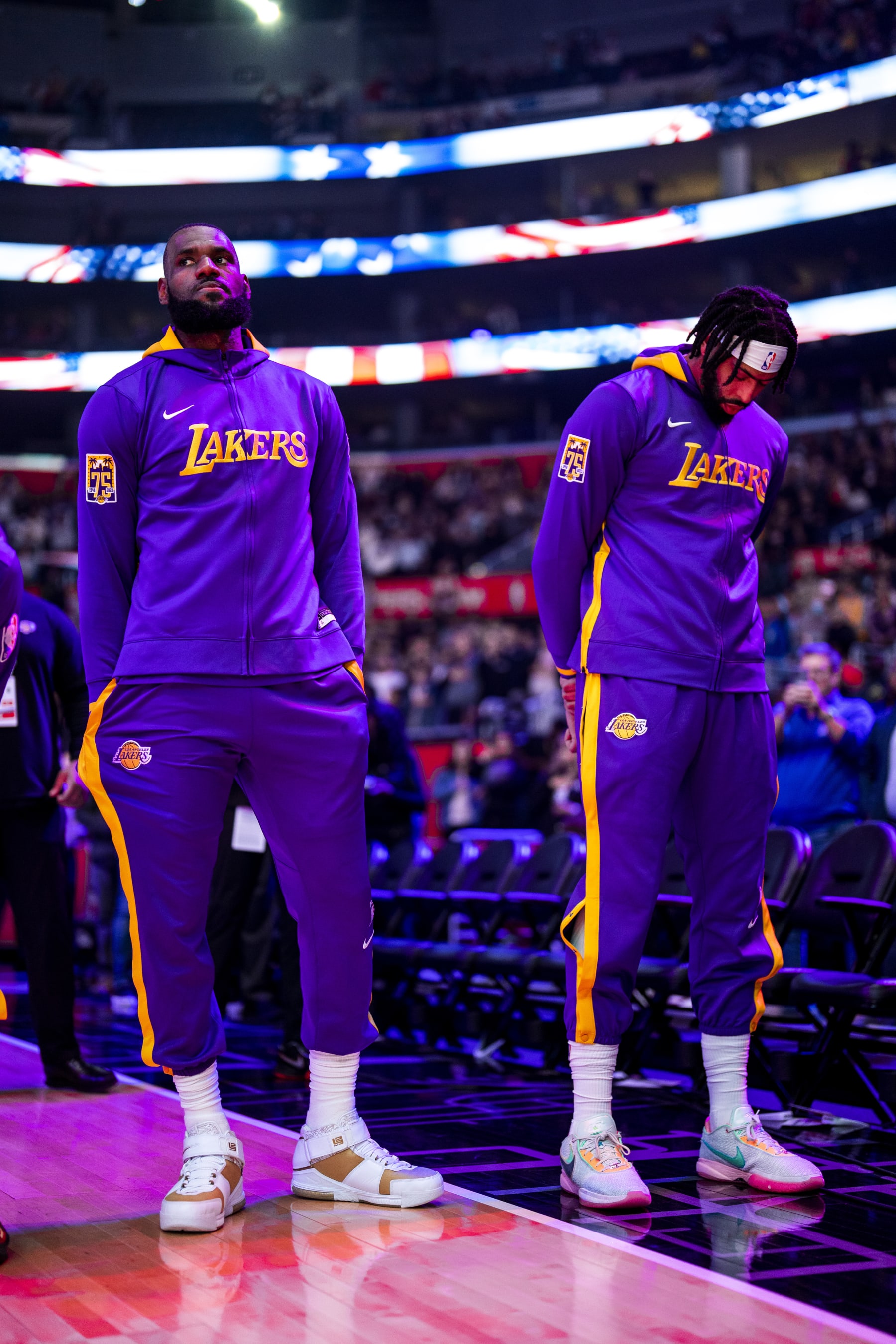 LOS ANGELES, CA - NOVEMBER 9: LeBron James #6 and Anthony Davis #3 of the Los Angeles Lakers stand for the national anthem before the game against the LA Clippers on November 9, 2022 at Crypto.Com Arena in Los Angeles, California. NOTE TO USER: User expressly acknowledges and agrees that, by downloading and/or using this Photograph, user is consenting to the terms and conditions of the Getty Images License Agreement. Mandatory Copyright Notice: Copyright 2022 NBAE (Photo by Tyler Ross/NBAE via Getty Images)