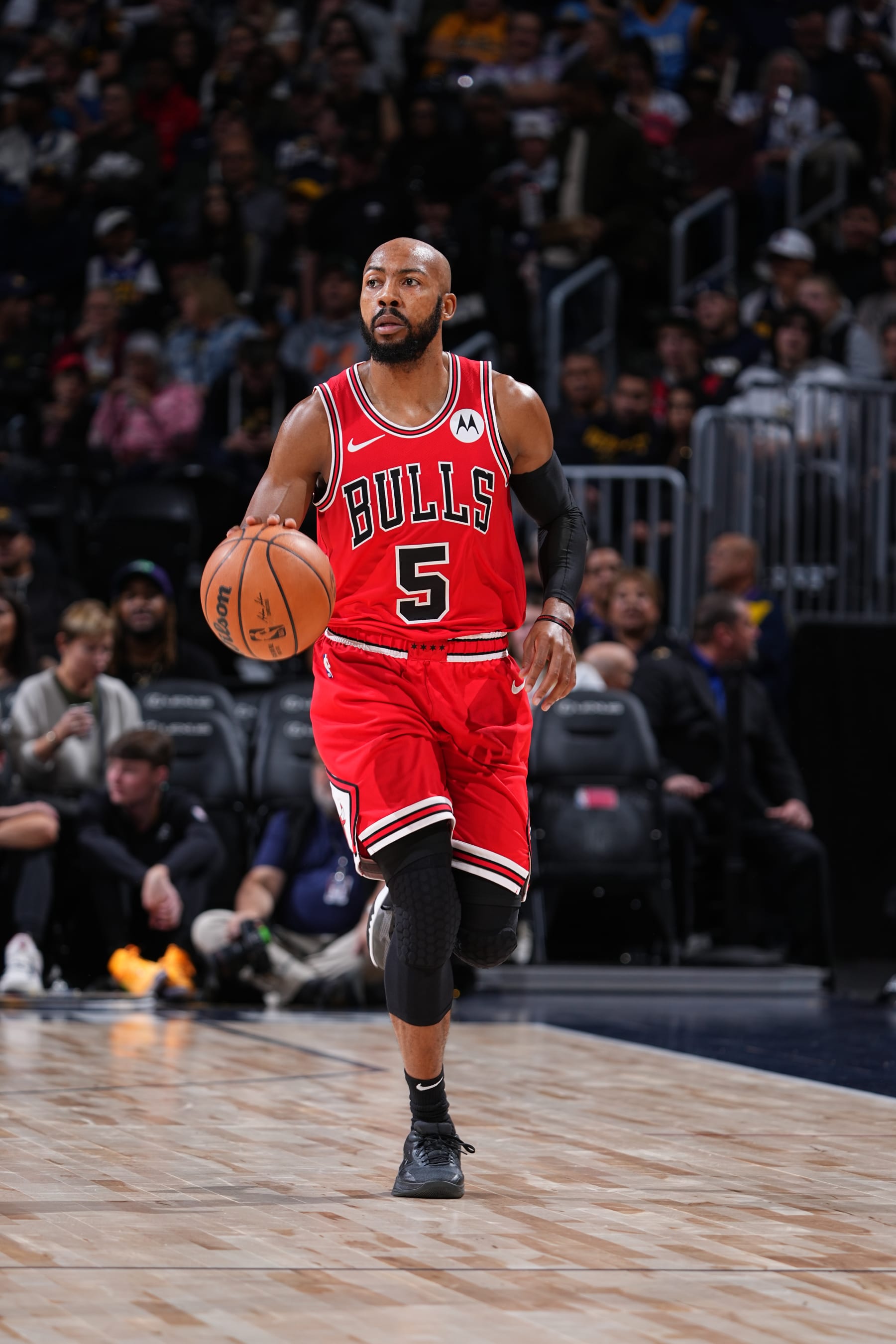 DENVER, CO - OCTOBER 15: Jevon Carter #5 of the Chicago Bulls brings the ball up court against the Denver Nuggets on October 15, 2023 at the Ball Arena in Denver, Colorado. NOTE TO USER: User expressly acknowledges and agrees that, by downloading and/or using this Photograph, user is consenting to the terms and conditions of the Getty Images License Agreement. Mandatory Copyright Notice: Copyright 2023 NBAE (Photo by Garrett Ellwood/NBAE via Getty Images)