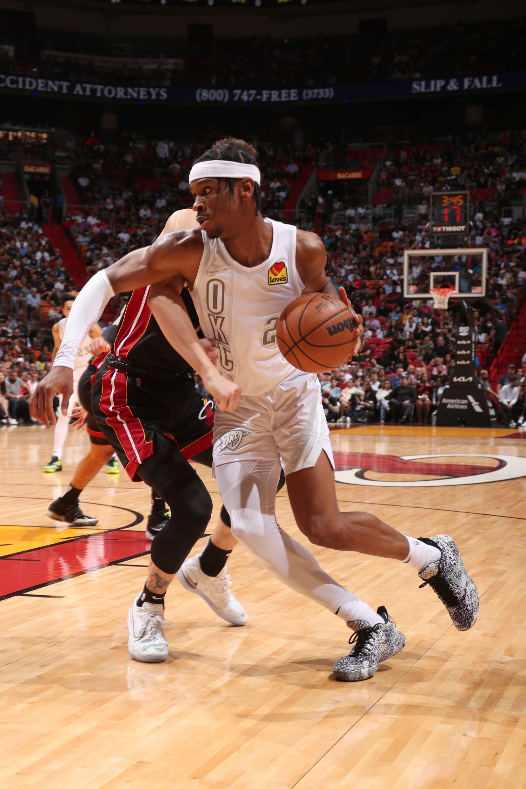 MIAMI, FL - MARCH 18: Shai Gilgeous-Alexander #2 of the Oklahoma City Thunder drives to the basket during the game against the Miami Heat on March 18, 2022 at FTX Arena in Miami, Florida. NOTE TO USER: User expressly acknowledges and agrees that, by downloading and or using this Photograph, user is consenting to the terms and conditions of the Getty Images License Agreement. Mandatory Copyright Notice: Copyright 2022 NBAE (Photo by Issac Baldizon/NBAE via Getty Images)
