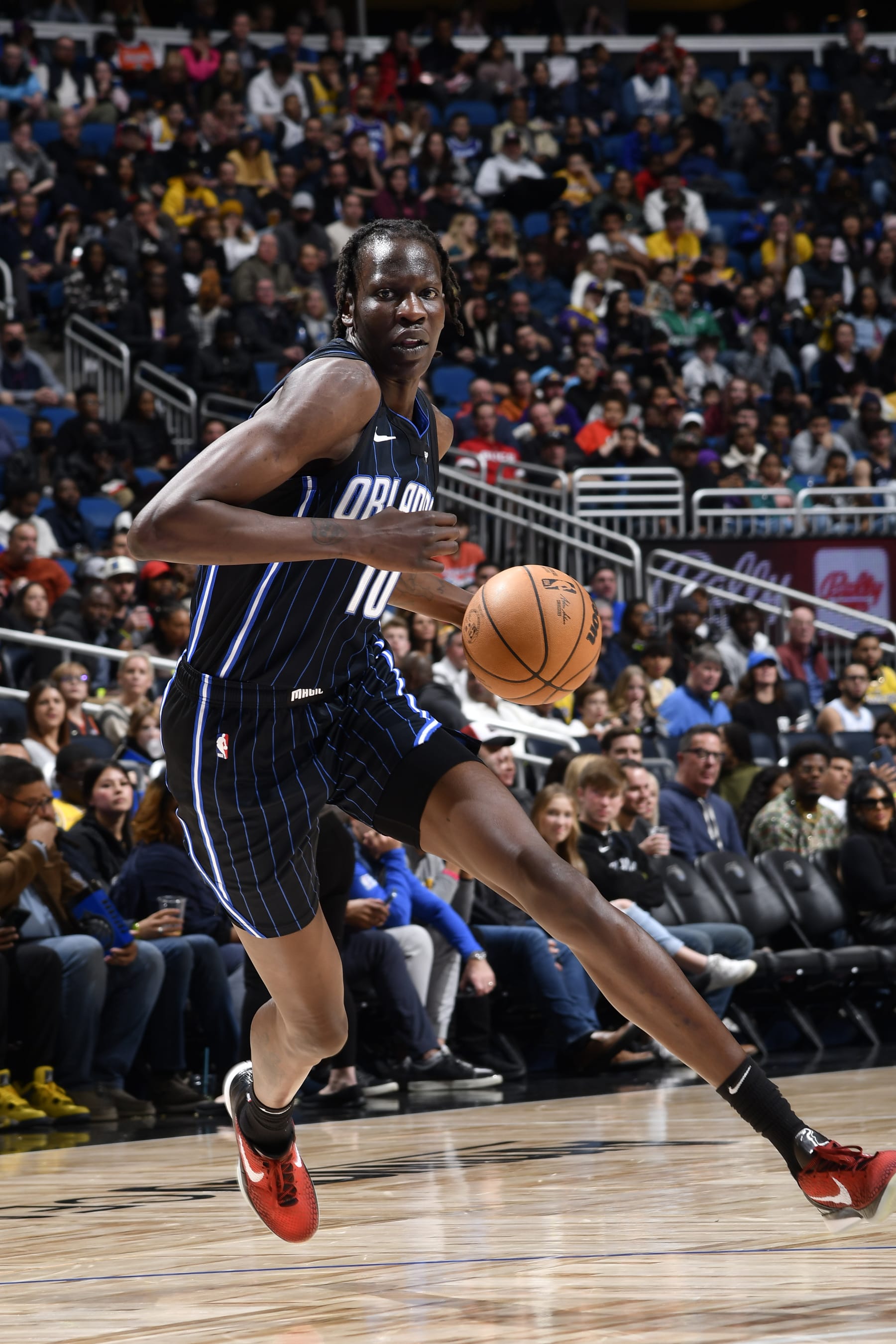 ORLANDO, FL - DECEMBER 27: Bol Bol #10 of the Orlando Magic dribbles the ball during the game against the Los Angeles Lakers on December 27, 2022 at Amway Center in Orlando, Florida. NOTE TO USER: User expressly acknowledges and agrees that, by downloading and or using this photograph, User is consenting to the terms and conditions of the Getty Images License Agreement. Mandatory Copyright Notice: Copyright 2022 NBAE (Photo by Fernando Medina/NBAE via Getty Images)