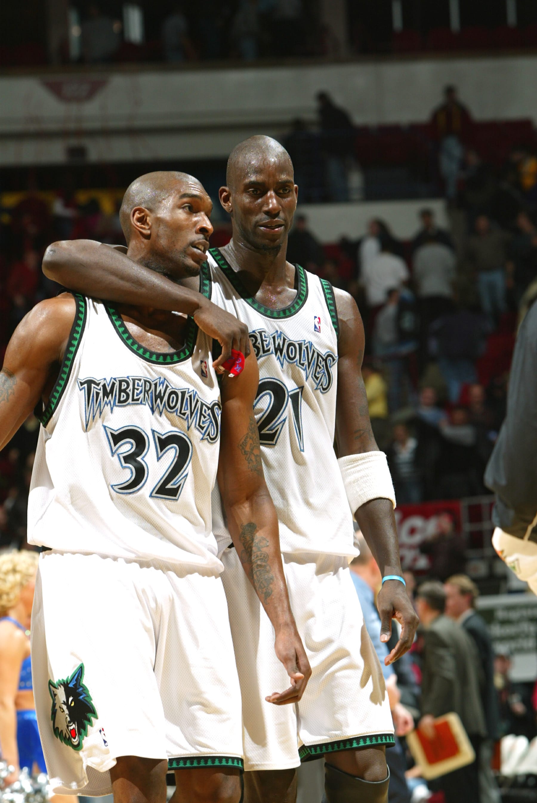 MINNEAPOLIS - JANUARY 27:  Kevin Garnett #21 of the Minnesota Timberwolves puts his arm around teammate Joe Smith #32 after a 106 to 95 victory over the San Antonio Spurs on January 27, 2003 at the Target Center in Minneapolis, Minnesota.   NOTICE TO USER: User expressly acknowledges and agrees that, by downloading and/or using this Photograph, user is consenting to the terms and conditions of the Getty Images License Agreement.  (Photo By David Sherman/NBAE via Getty Images)