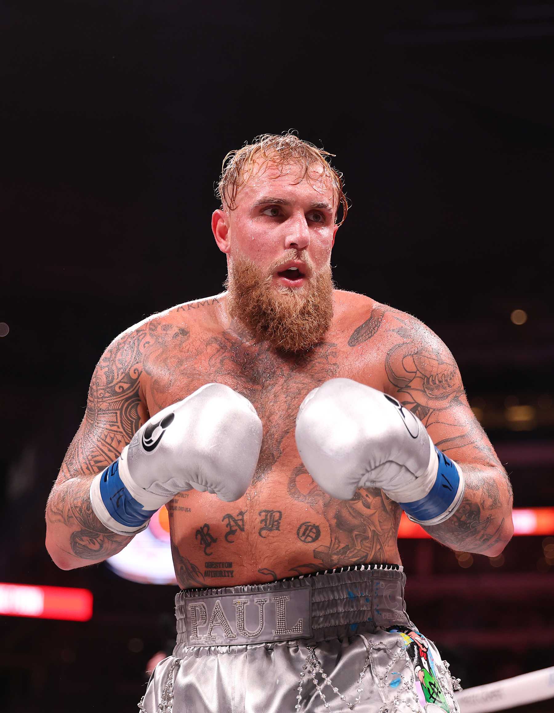 ARLINGTON, TEXAS - NOVEMBER 15:  Jake Paul in action against Mike Tyson fight during LIVE On Netflix: Jake Paul vs. Mike Tyson at AT&T Stadium on November 15, 2024 in Arlington, Texas.   (Photo by Al Bello/Getty Images for Netflix Â© 2024)