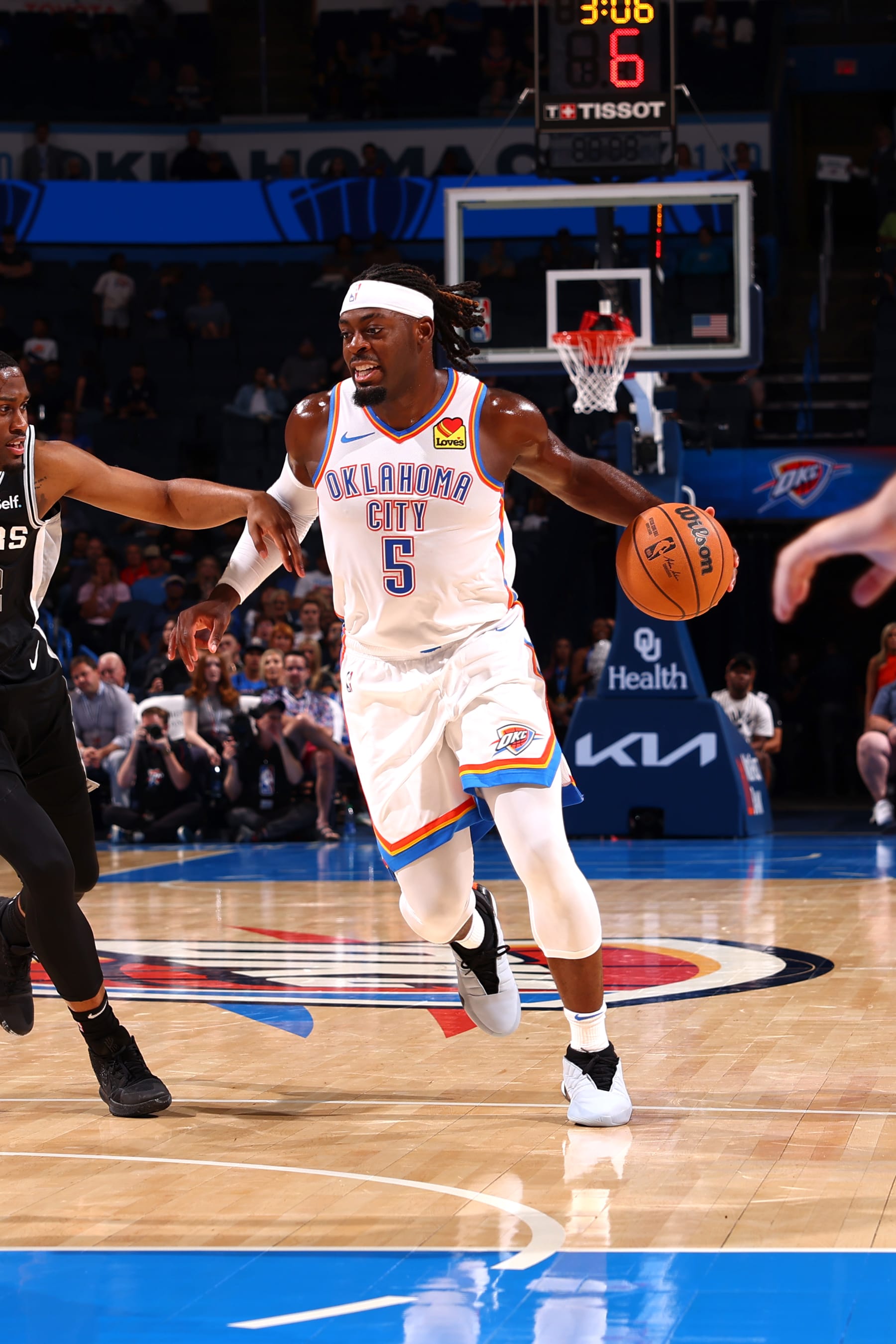 OKLAHOMA CITY, OK - OCTOBER 9: Luguentz Dort #5 of the Oklahoma City Thunder dribbles the ball during the game against the San Antonio Spurs on October 9, 2023 at Paycom Arena in Oklahoma City, Oklahoma. NOTE TO USER: User expressly acknowledges and agrees that, by downloading and or using this photograph, User is consenting to the terms and conditions of the Getty Images License Agreement. Mandatory Copyright Notice: Copyright 2023 NBAE (Photo by Zach Beeker/NBAE via Getty Images)