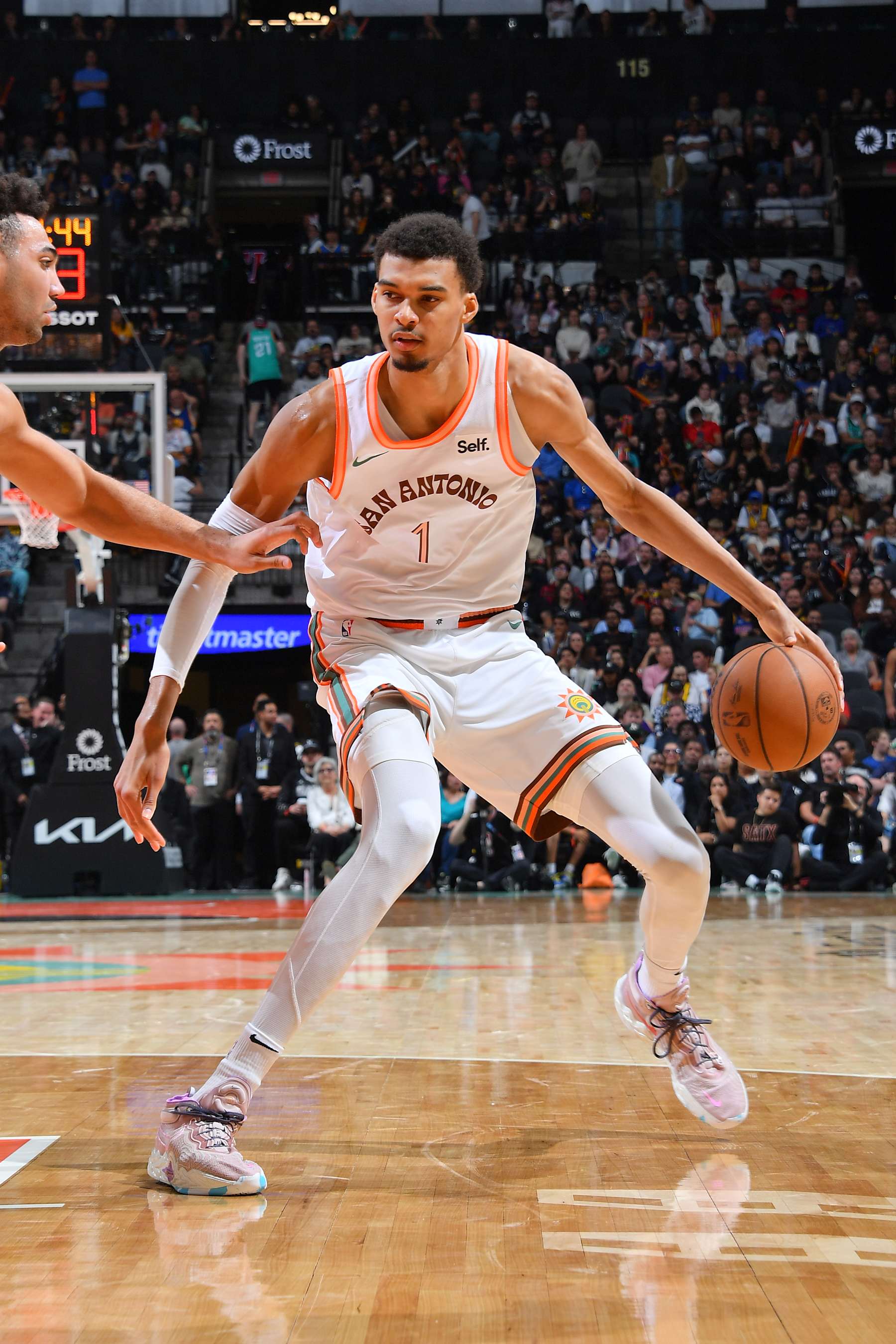 SAN ANTONIO, TX - MARCH 31: Victor Wembanyama #1 of the San Antonio Spurs dribbles the ball during the game against the Golden State Warriors on March 31, 2024 at the Frost Bank Center in San Antonio, Texas. NOTE TO USER: User expressly acknowledges and agrees that, by downloading and or using this photograph, user is consenting to the terms and conditions of the Getty Images License Agreement. Mandatory Copyright Notice: Copyright 2024 NBAE (Photos by Michael Gonzales/NBAE via Getty Images)