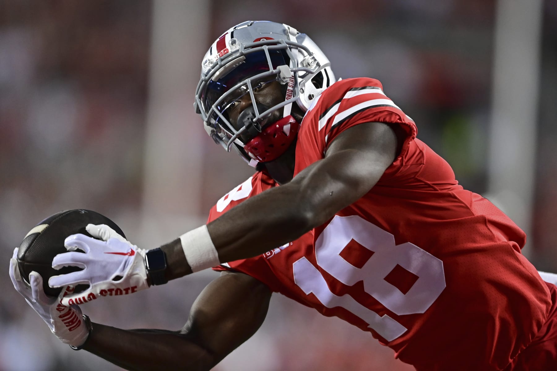 Ohio State wide receiver Marvin Harrison Jr. reaches for a pass during the first quarter of an NCAA college football game against Notre Dame, Saturday, Sept. 3, 2022, in Columbus, Ohio. Ohio State won 21-10. (AP Photo/David Dermer)